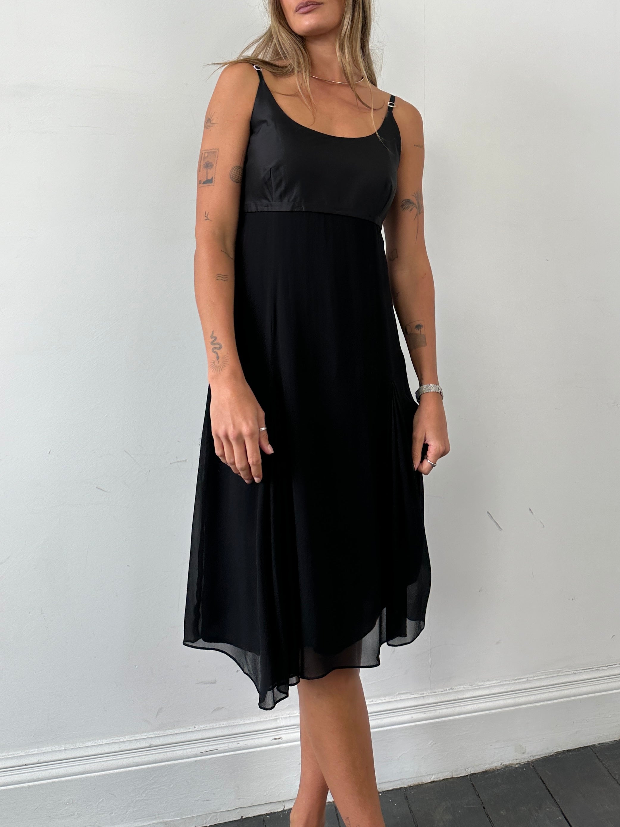 Max Mara pure silk pleated midi dress in soft fabric with elegant detailing, displayed on a hanger.