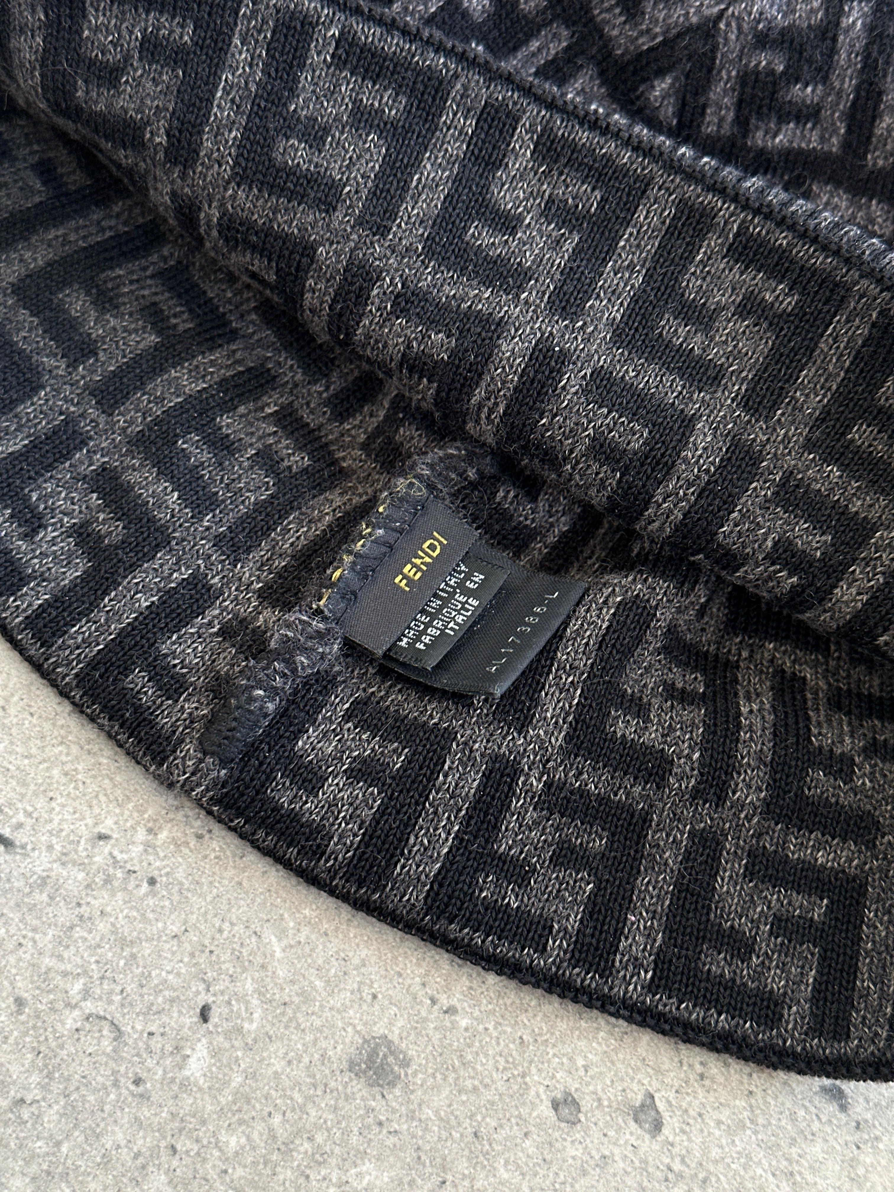Fendi FF Monogram print beanie hat in black and beige with the iconic logo pattern, made of soft knit fabric.