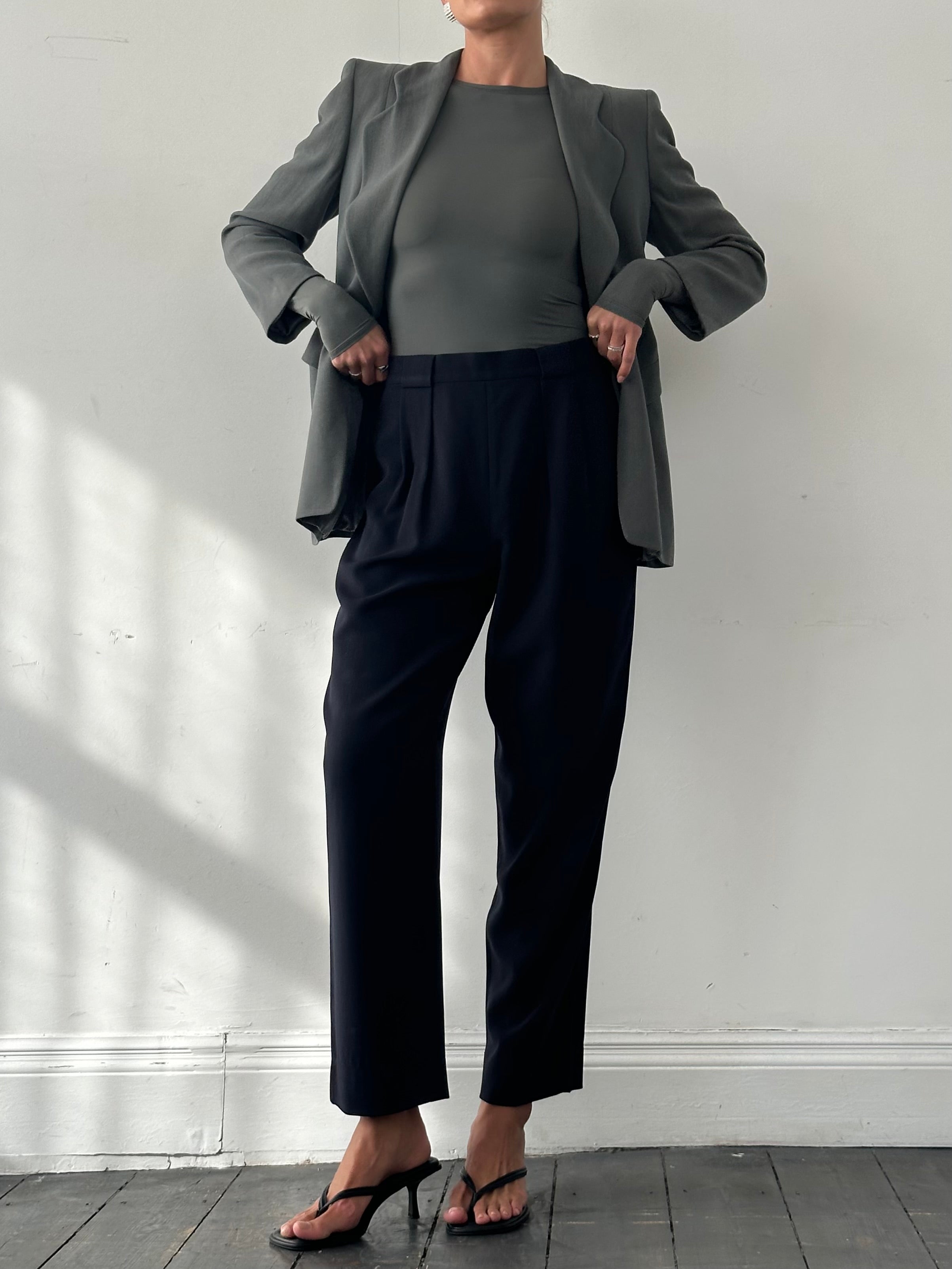 Giorgio Armani 1990s high-waisted pure wool tapered trousers in beige, front view showcasing tailored fit and classic style.
