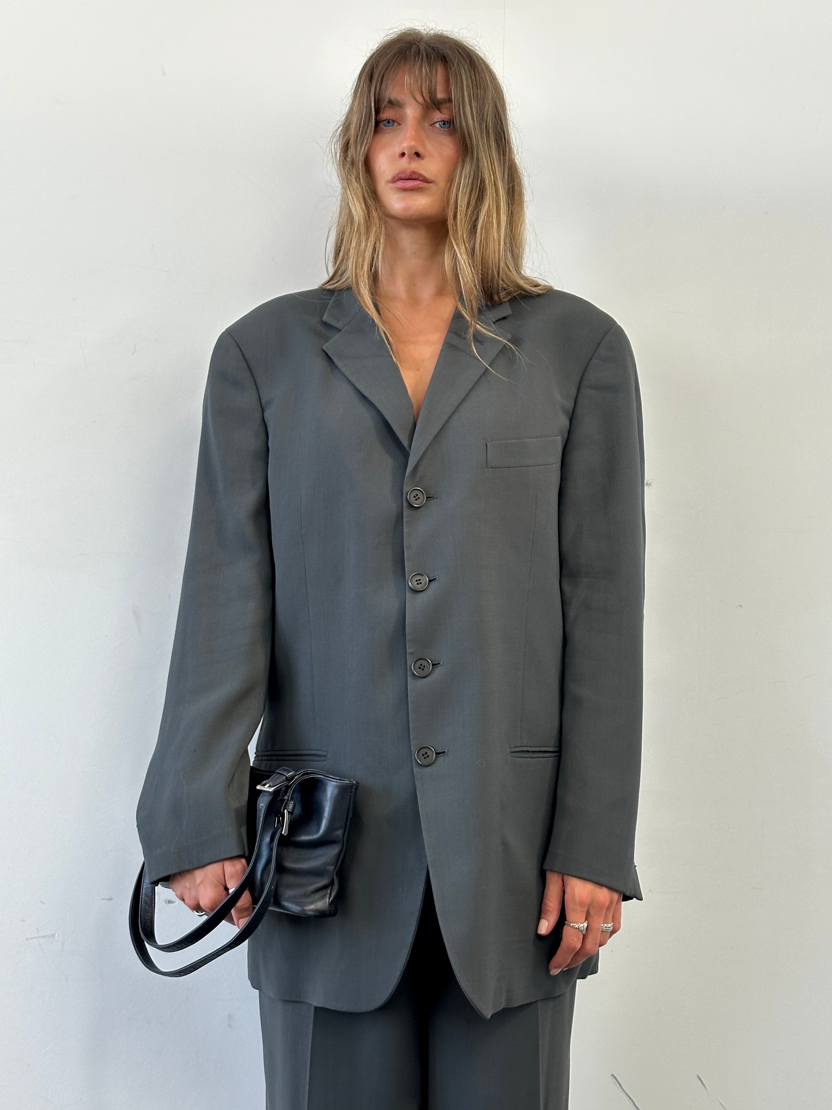 Giorgio Armani Le Collezioni wool relaxed single-breasted suit in size 42R/W34, displayed as a stylish jumpsuit.