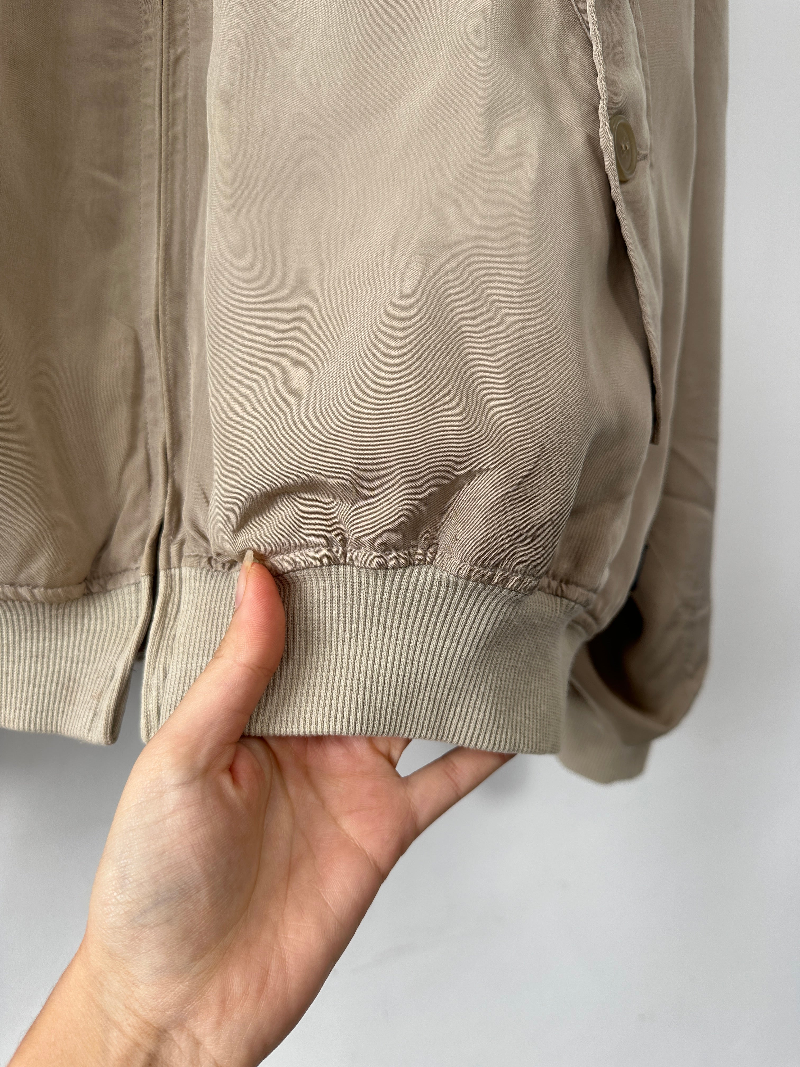 Vintage pure silk bomber jacket in XL, shown in classic style with smooth, shiny fabric and ribbed collar and cuffs.