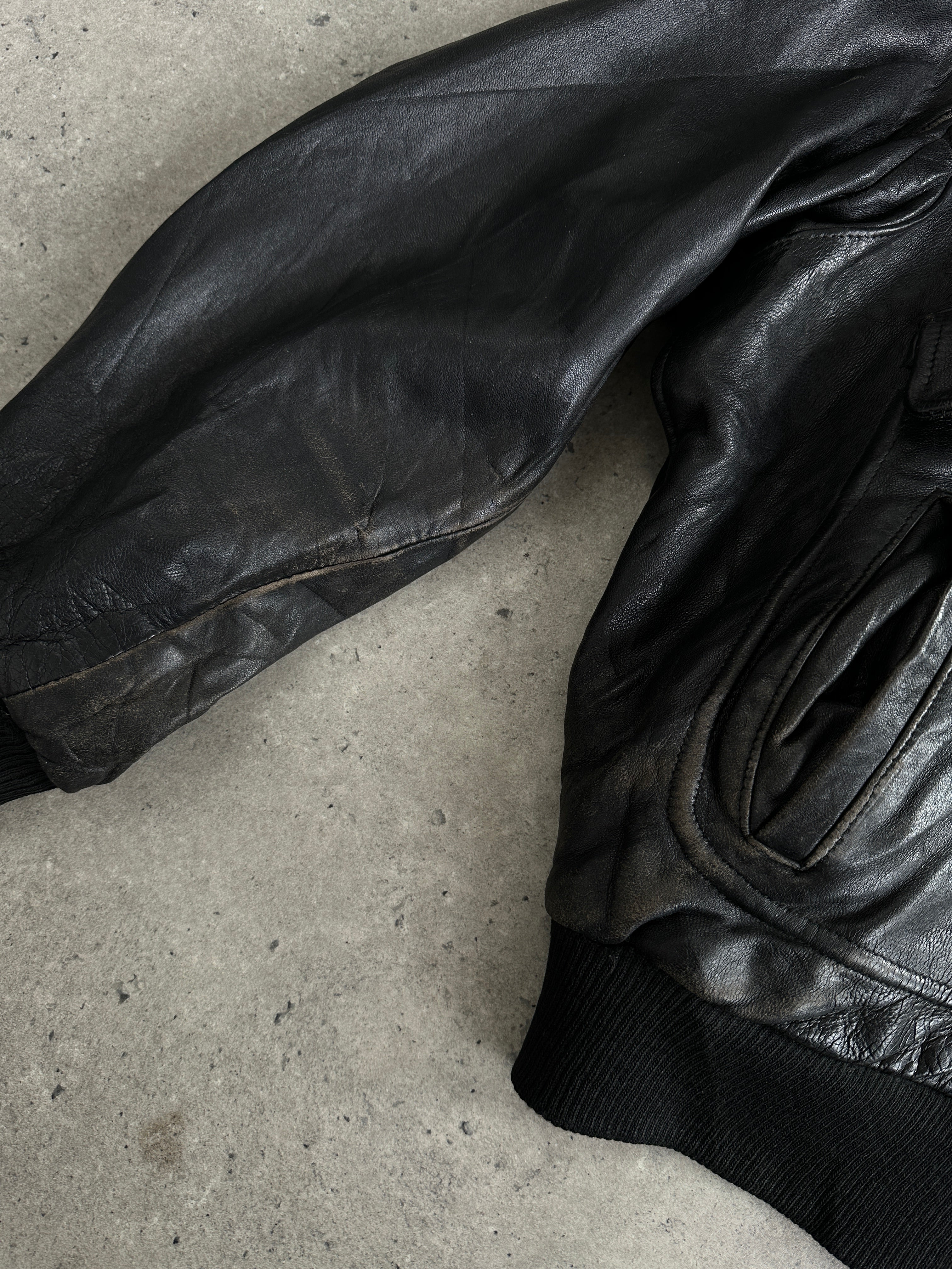 Vintage Italian leather bomber jacket with removable fleece lining, size large, featuring classic style and durable construction.
