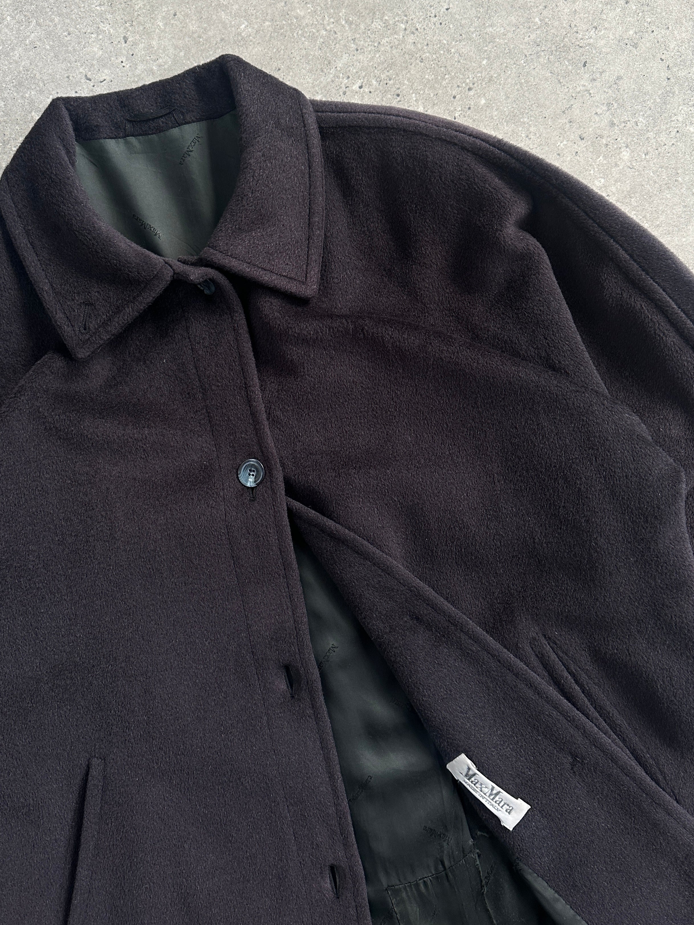 Max Mara wool cashmere single-breasted coat in size L, featuring a classic tailored fit and neutral color, displayed on a hanger.
