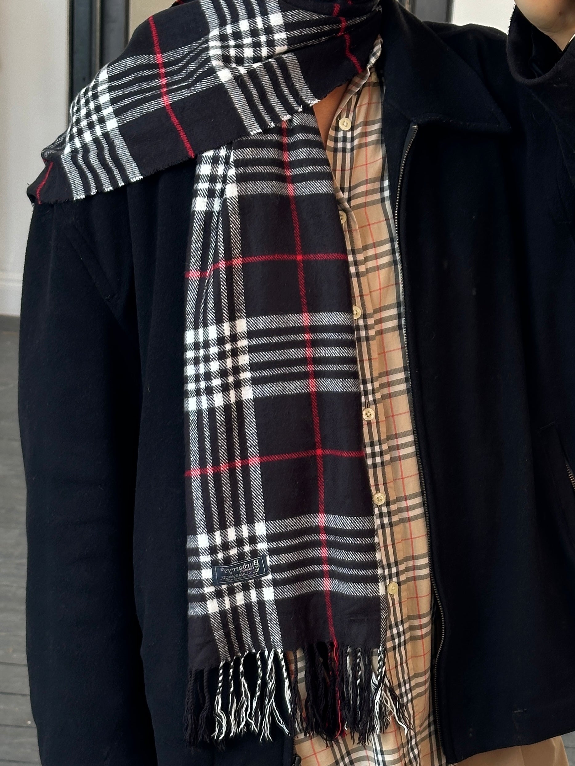 Burberry 1990s pure lambswool Nova Check scarf featuring classic beige, black, red, and white plaid pattern.