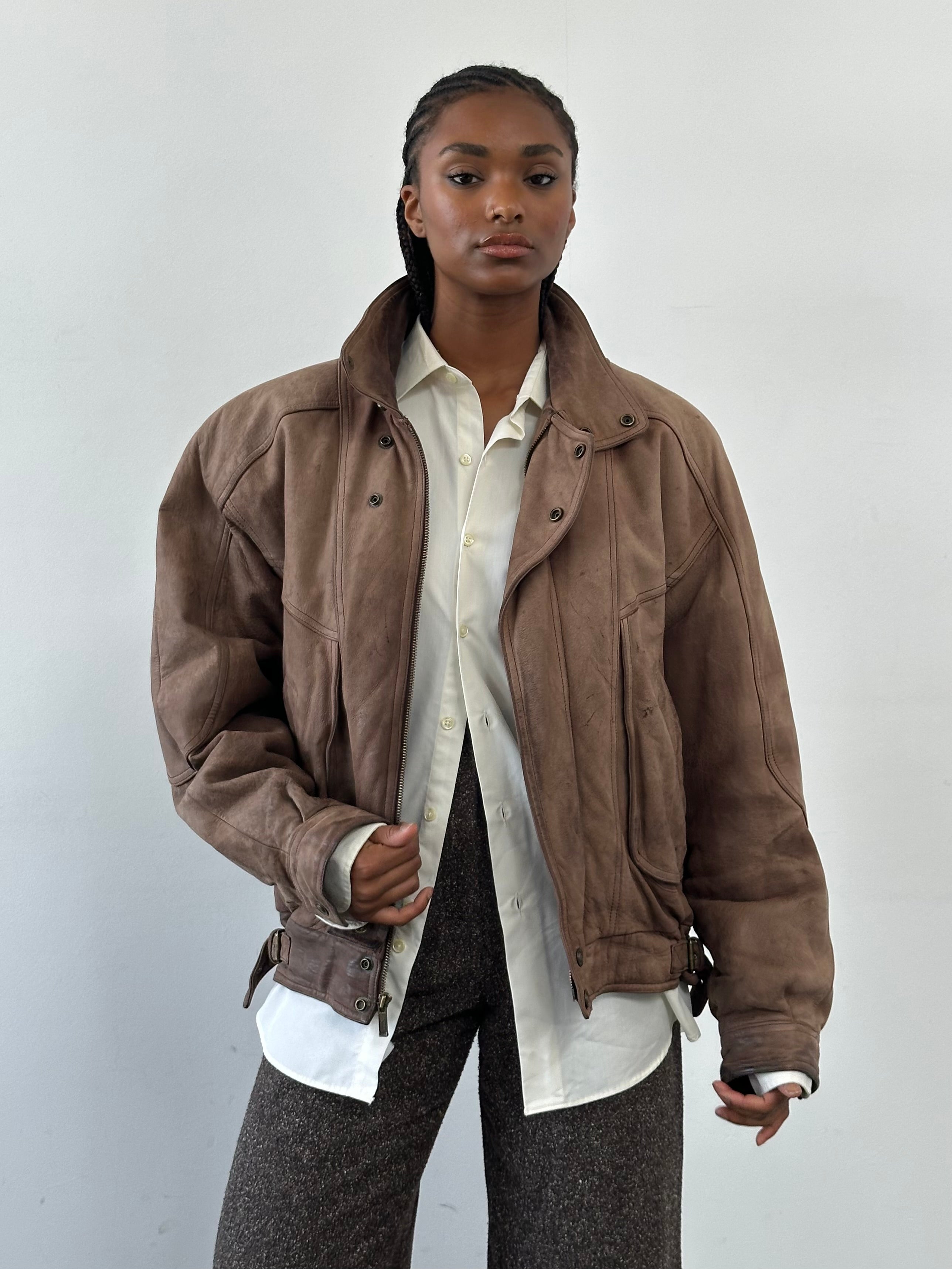 Vintage 1990s high-neck aged leather bomber jacket, size large, with classic design and distressed finish.