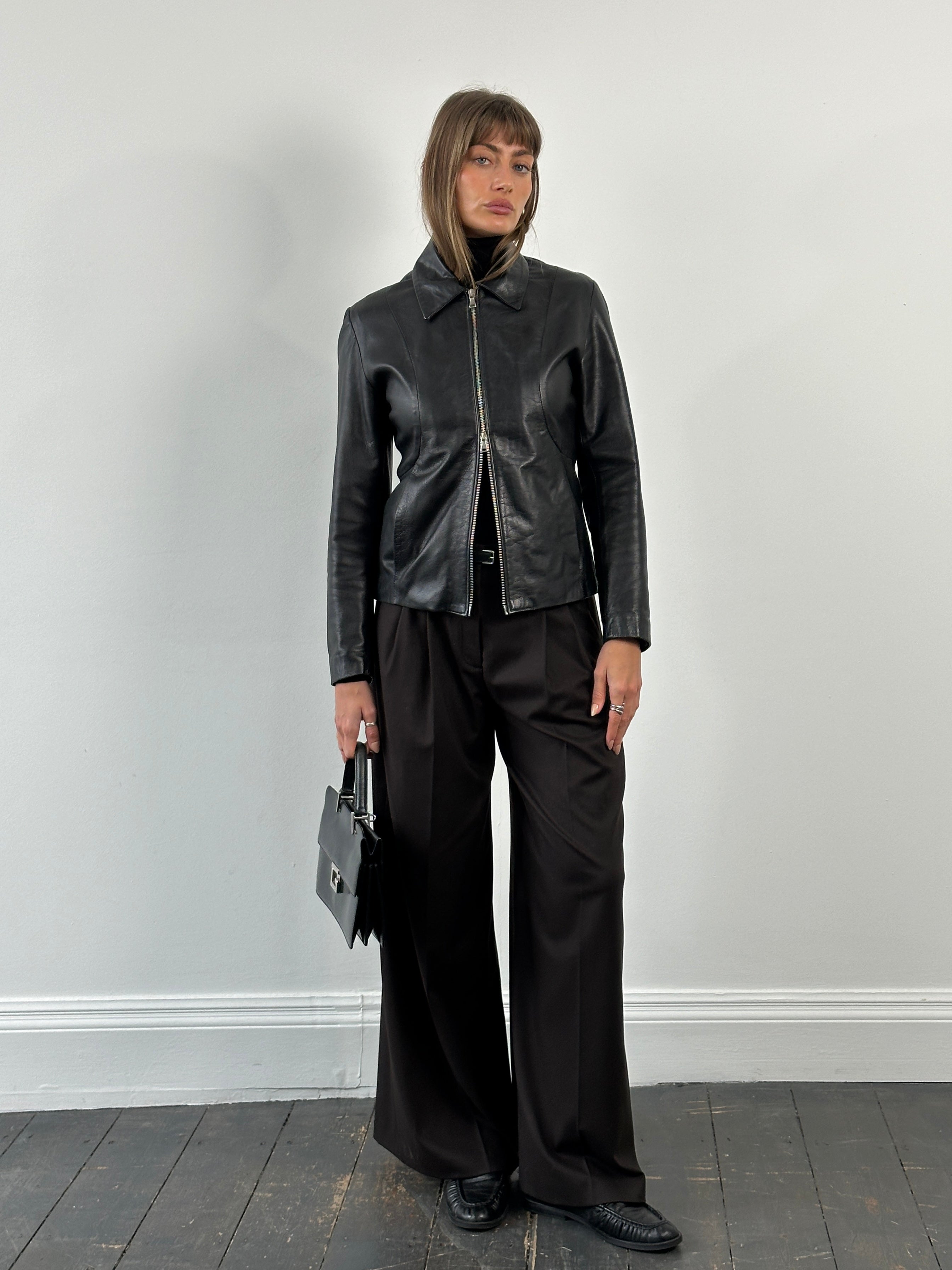 Italian vintage 1990s double zip leather jacket by Vintage, stylish black leather jacket with silver zippers and classic fit.