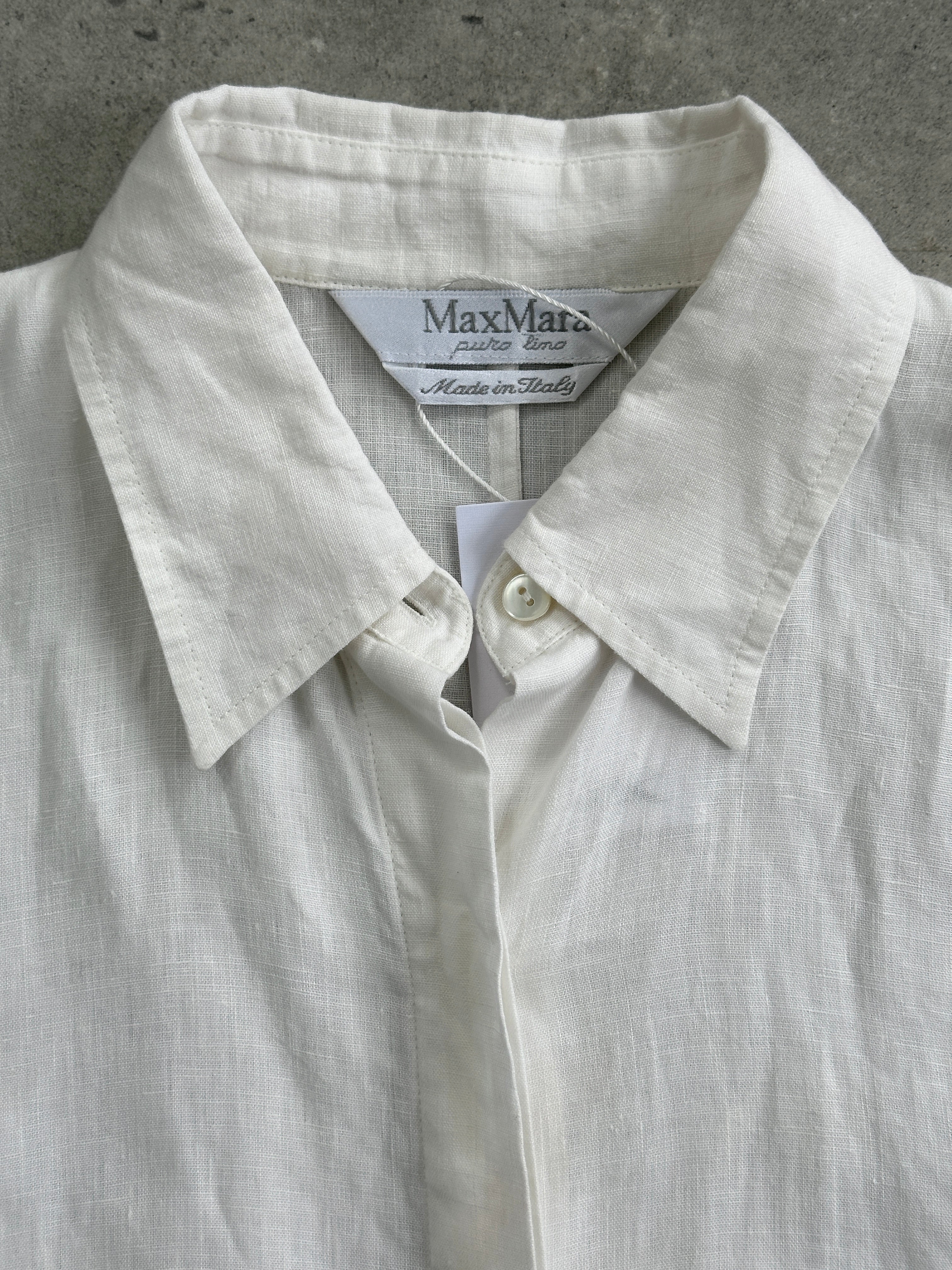 Max Mara pure linen short sleeve shirt in size small, lightweight and breathable, shown in a natural fabric close-up.