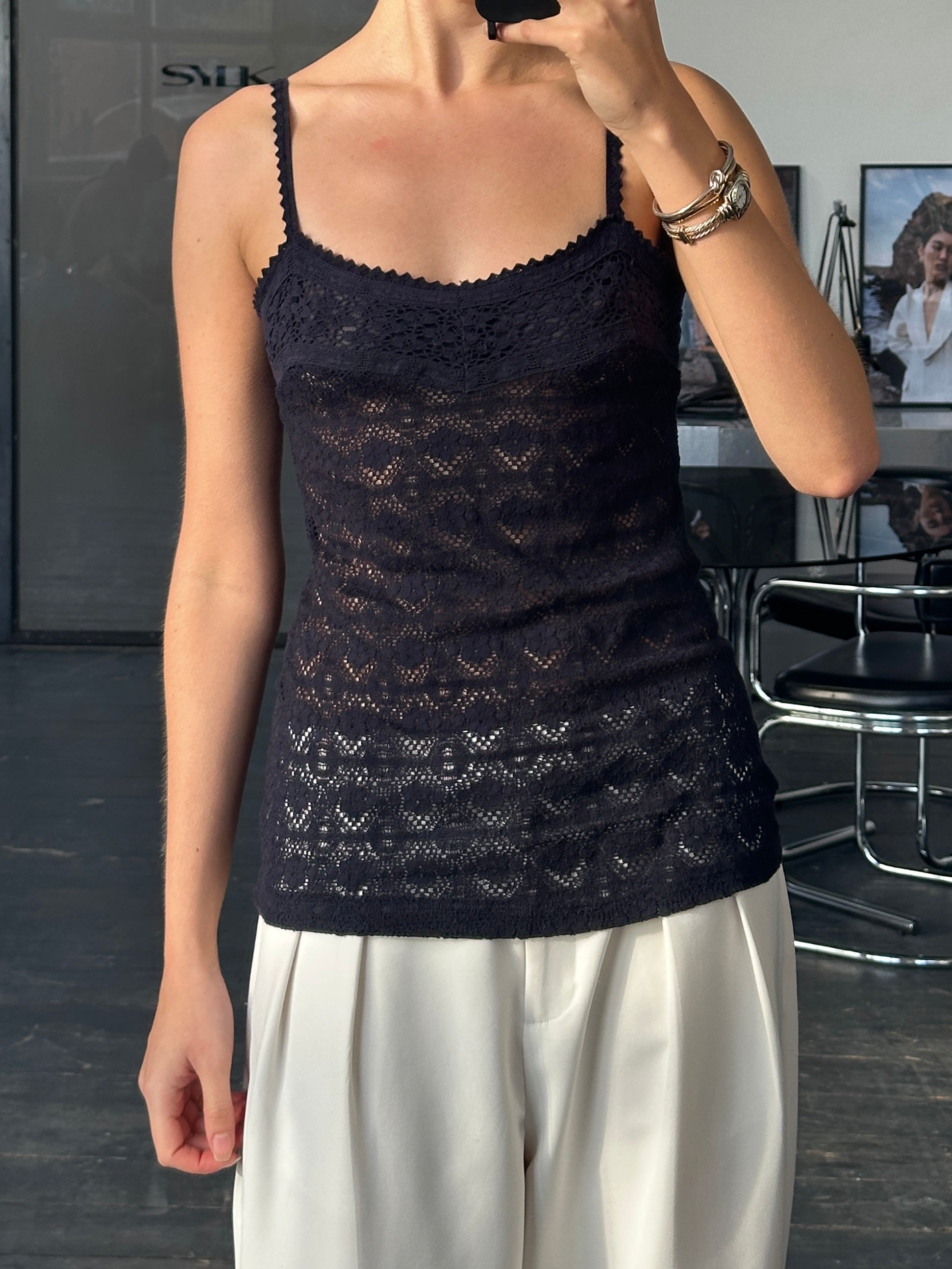 Vintage 2000s crochet cami top in black, featuring delicate knit pattern and thin straps, casual and stylish women’s top.