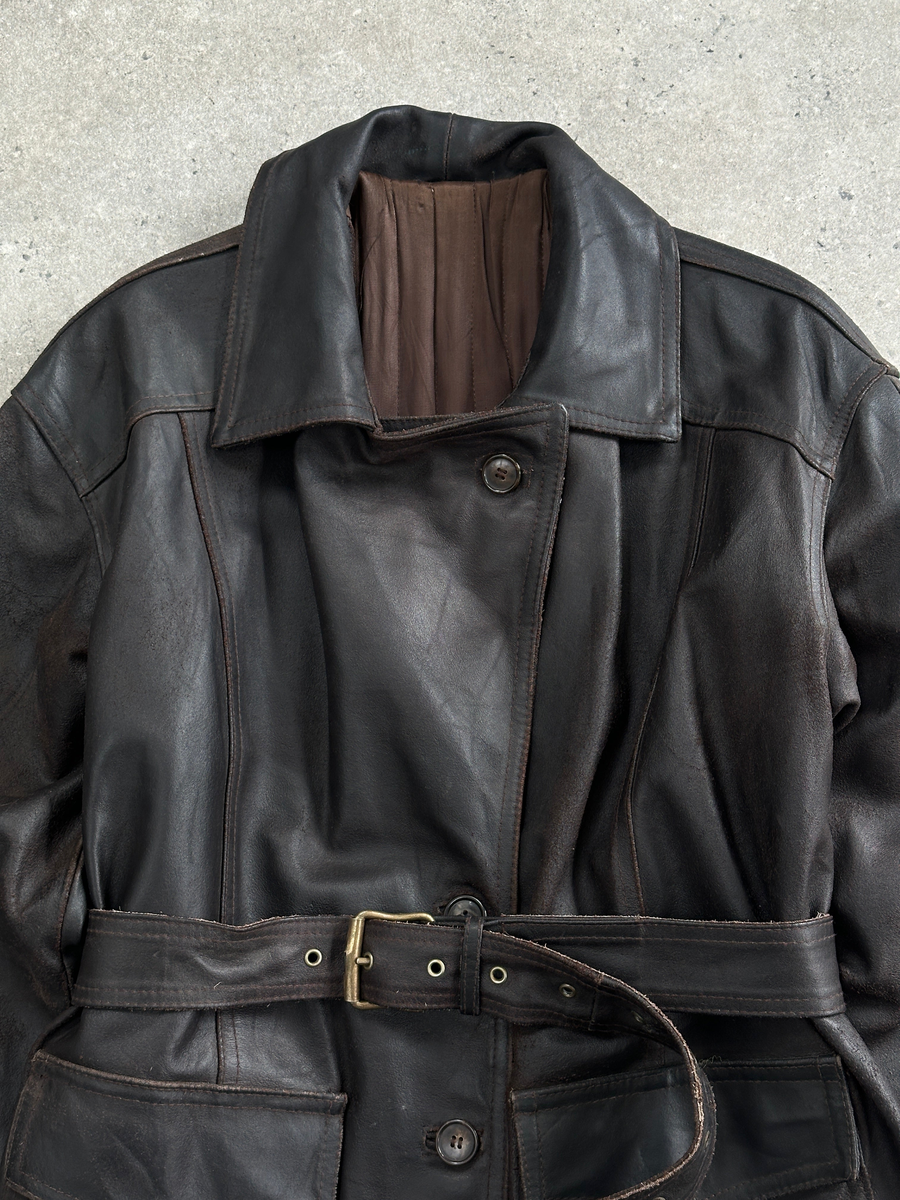 Vintage Italian 1980s belted leather jacket, medium size, featuring classic design and authentic leather details.