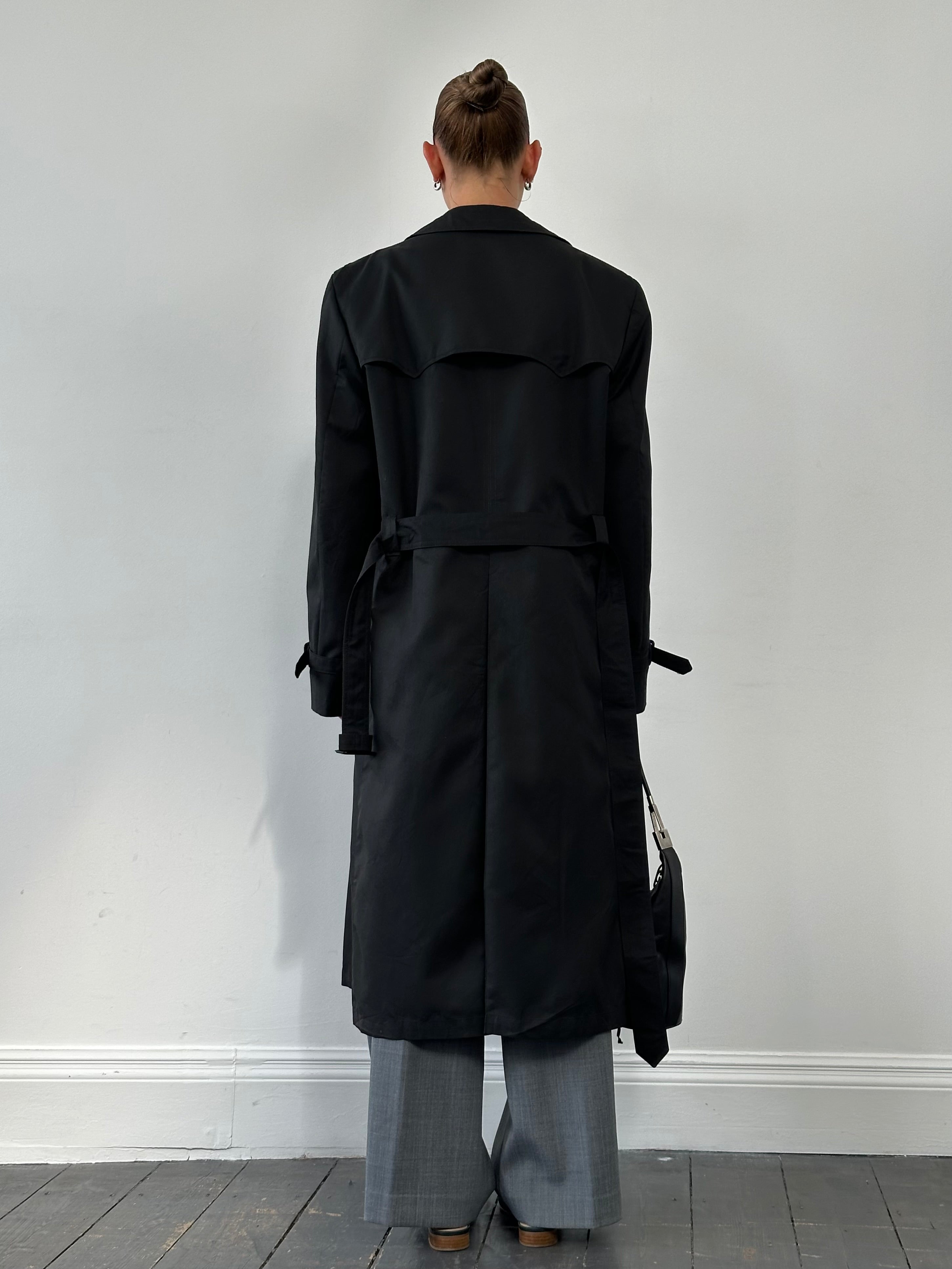 Christian Dior Monsieur double-breasted trench coat in XL, showing tailored design and classic beige fabric on a hanger.