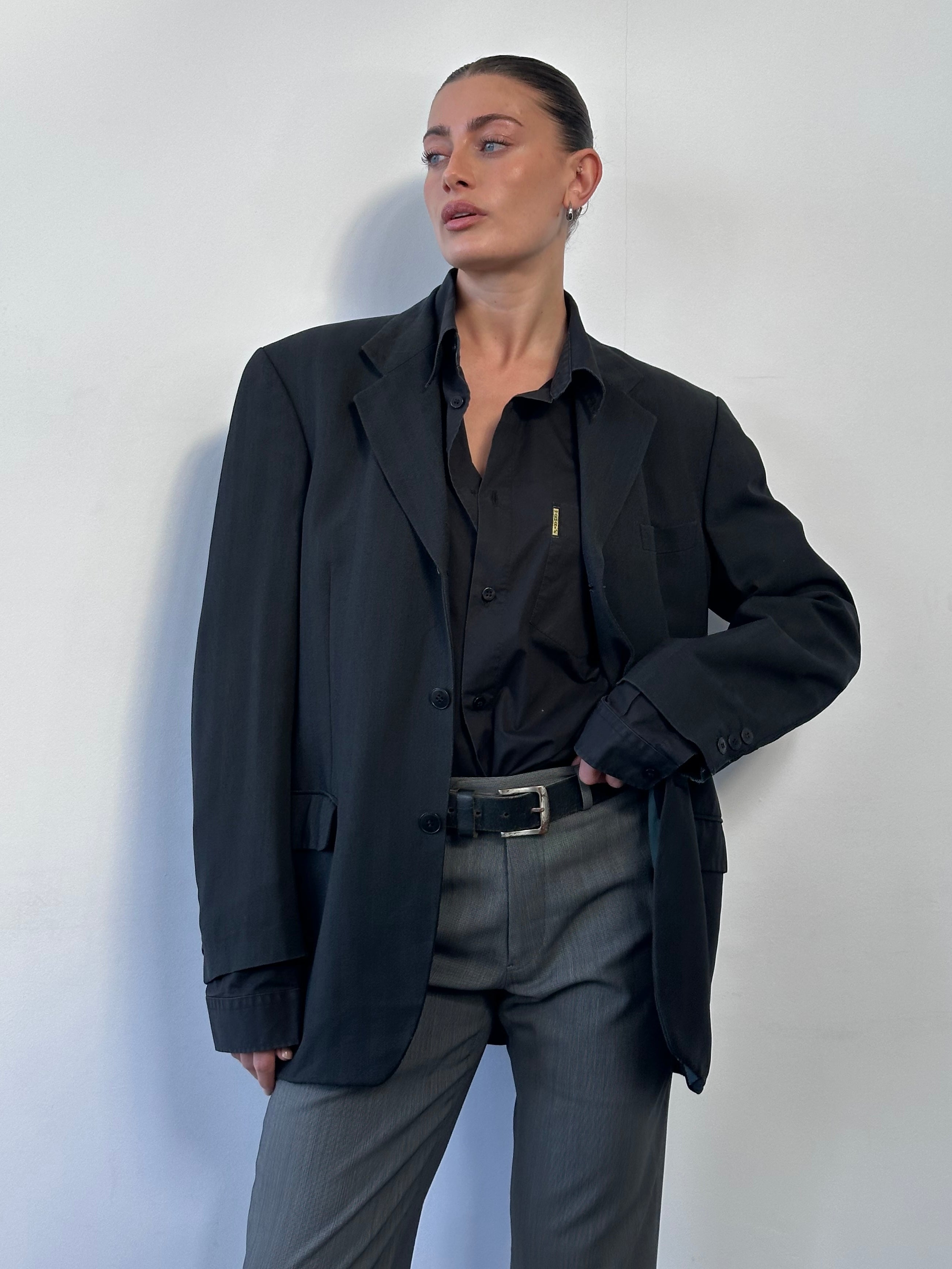 Yves Saint Laurent Pour Homme 1990s wool single-breasted blazer in size 40R/L, shown on a hanger with classic tailored fit.