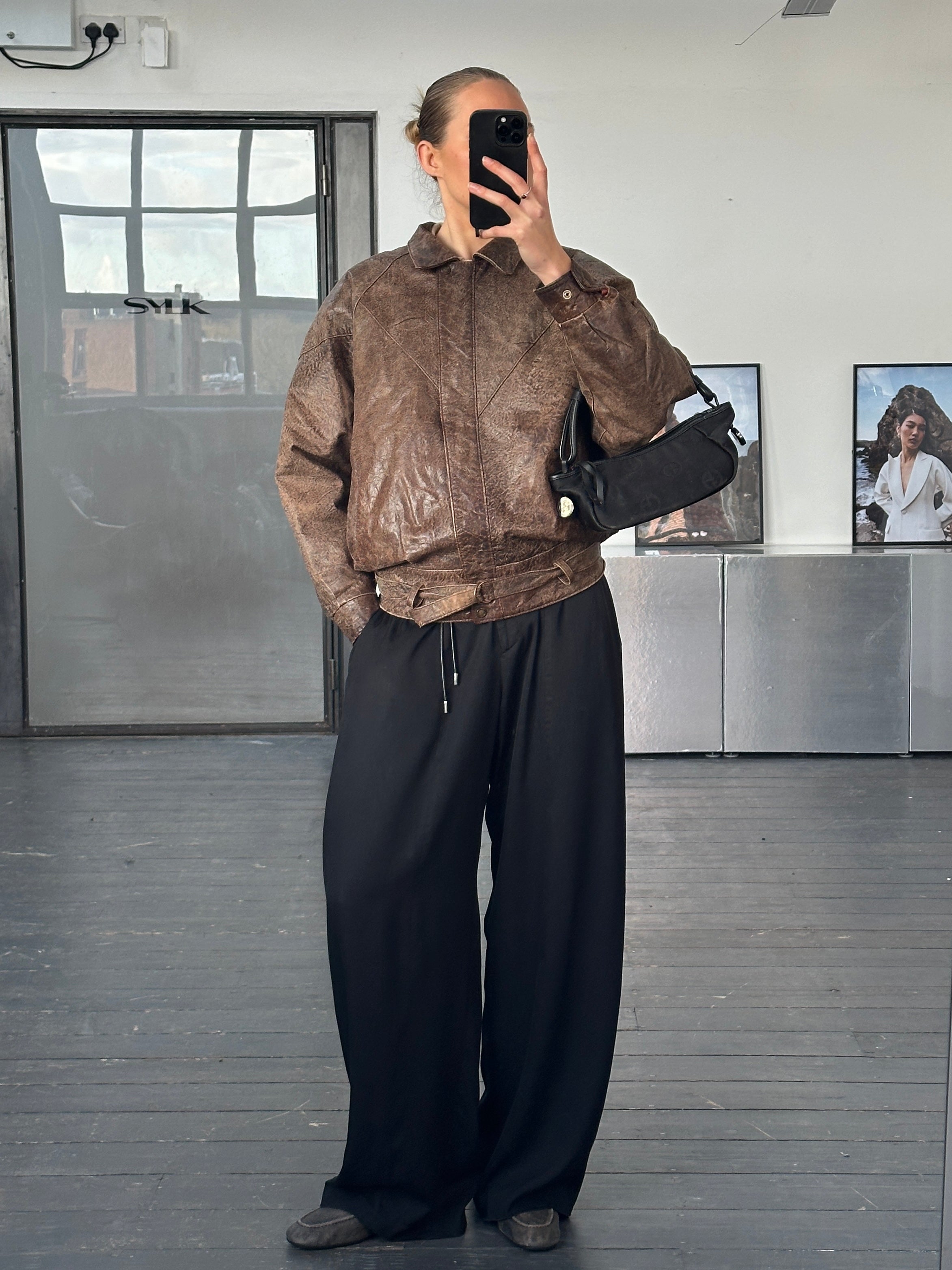 Vintage brand vintage 1980s aged leather jacket in size small, featuring distressed leather and classic style.