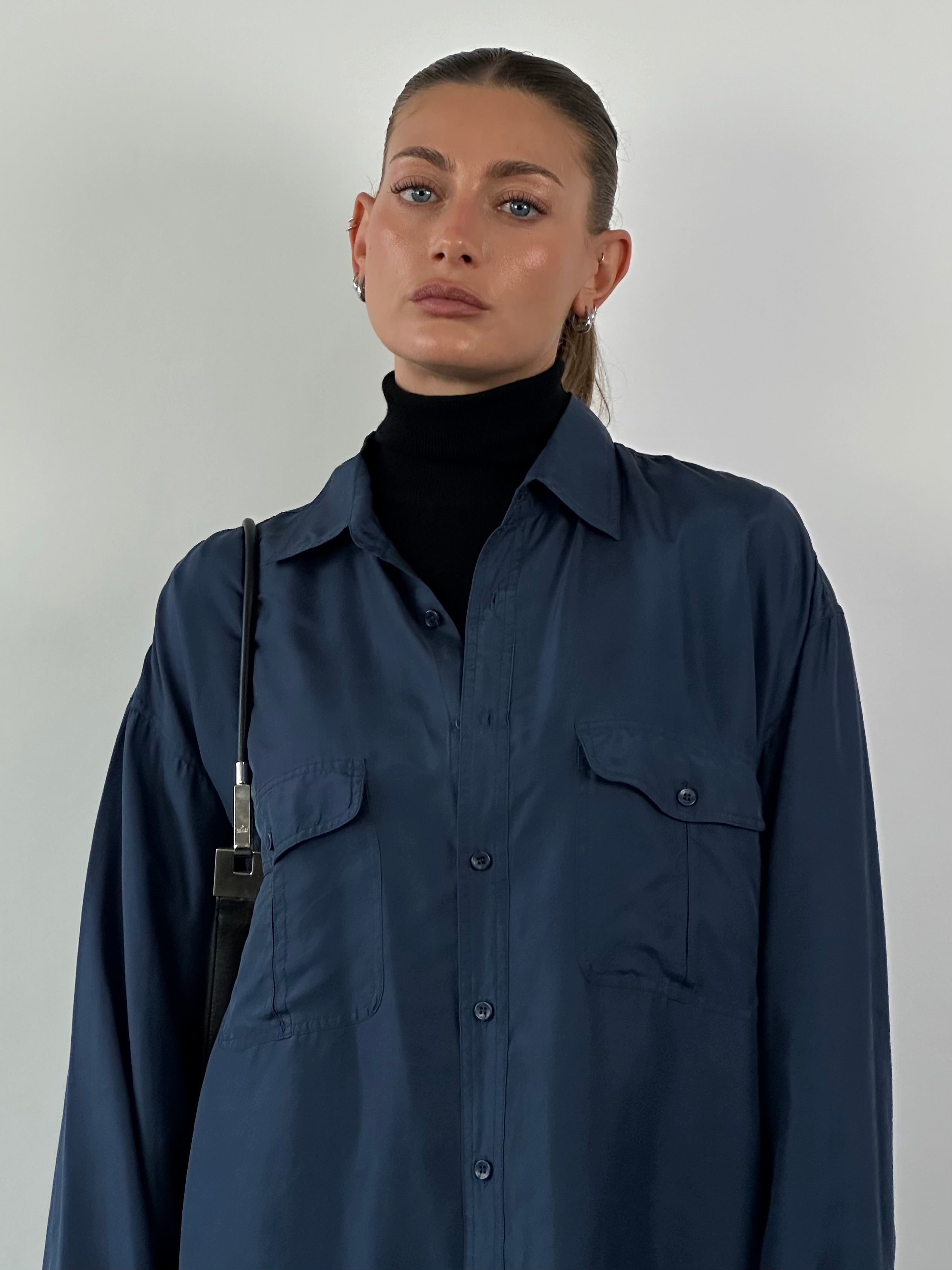 Vintage relaxed pure silk shirt in XXL, featuring a smooth, shiny fabric and classic collar, displayed on a hanger.