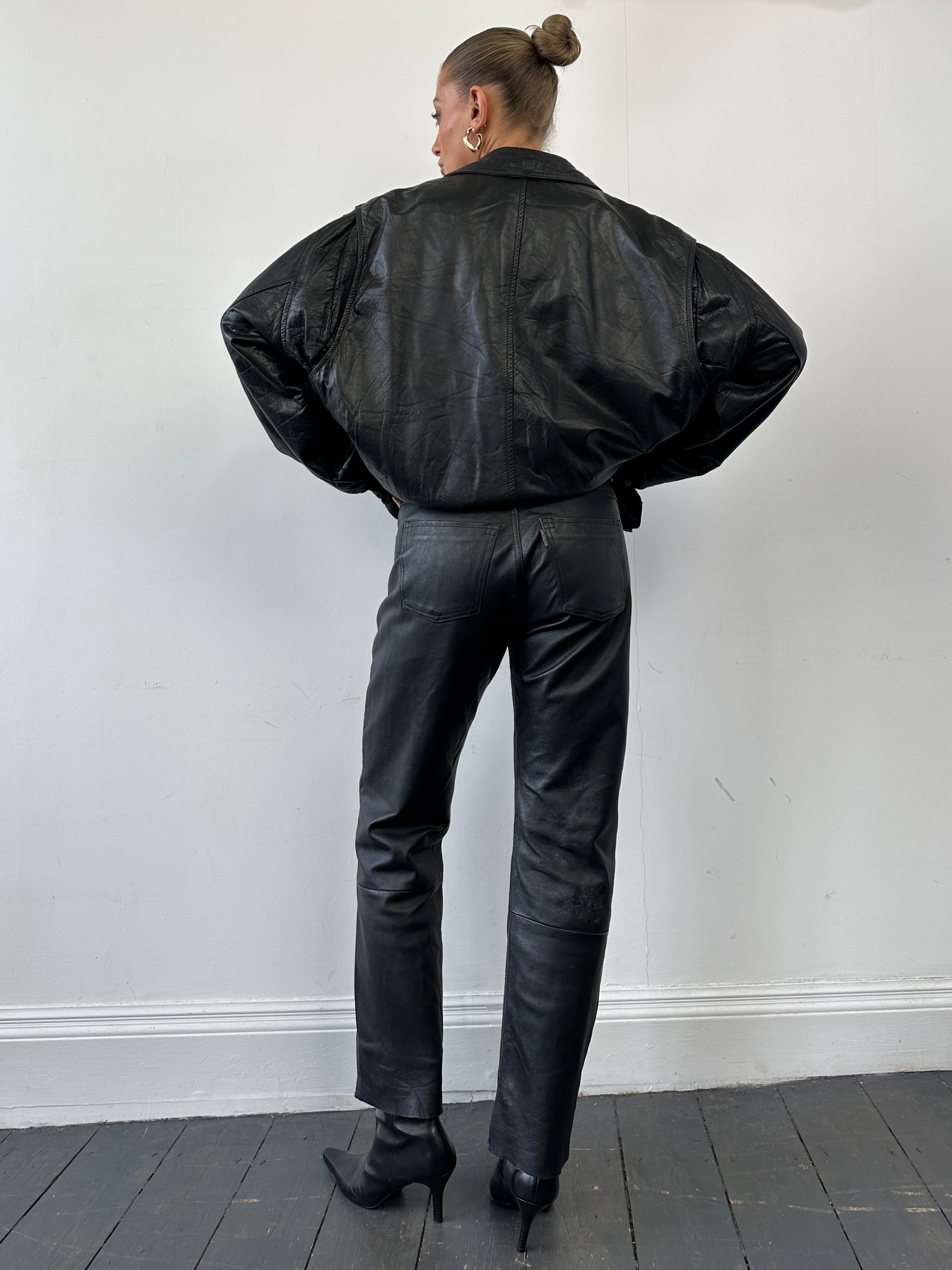 Vintage leather straight-leg trousers in size W30, showcasing classic design and high-quality material.