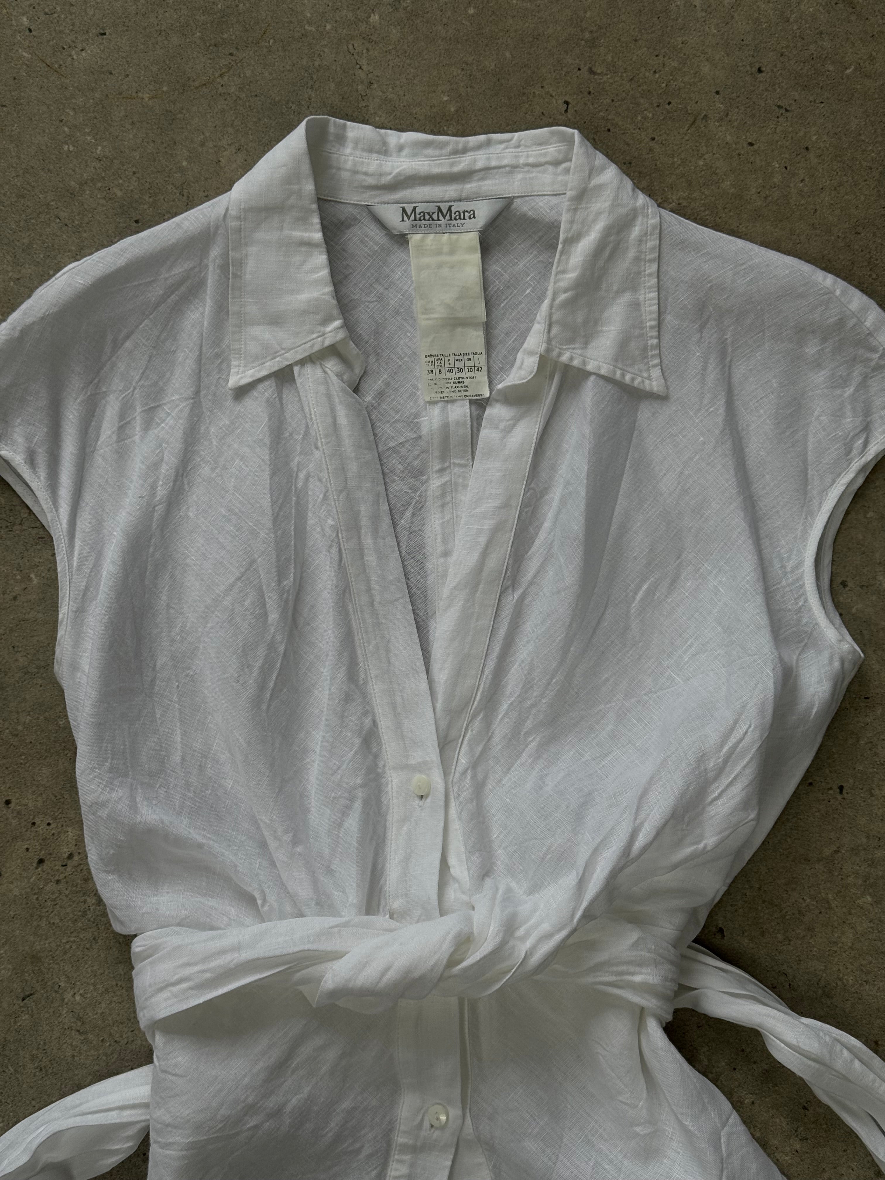 Max Mara 2000s pure linen sleeveless wrap shirt in S/M, lightweight and stylish with a classic design, shown in natural fabric detail.