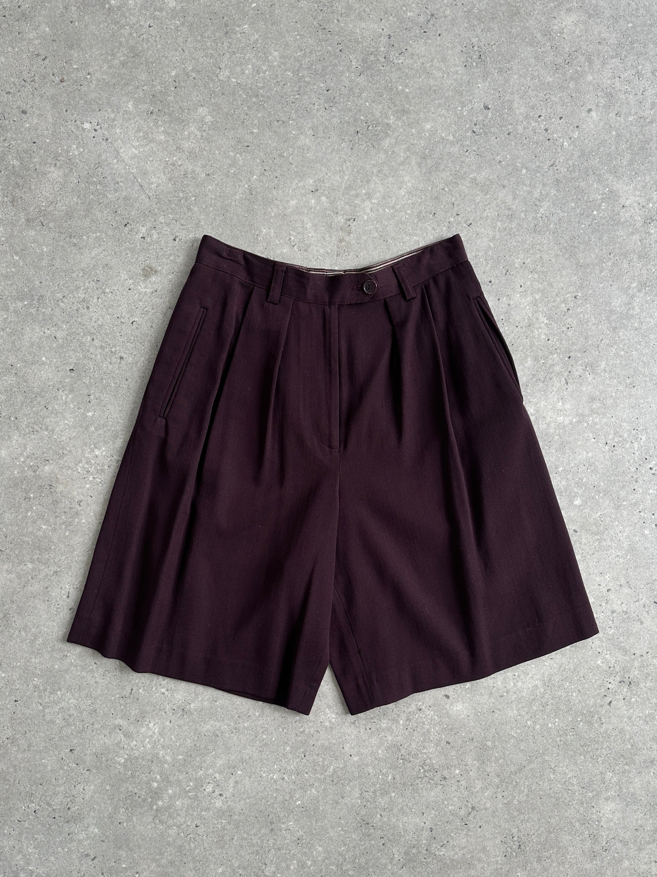 Emporio Armani wool high-waisted tailored shorts in dark color with belt loops and front pockets, styled for a sophisticated look.