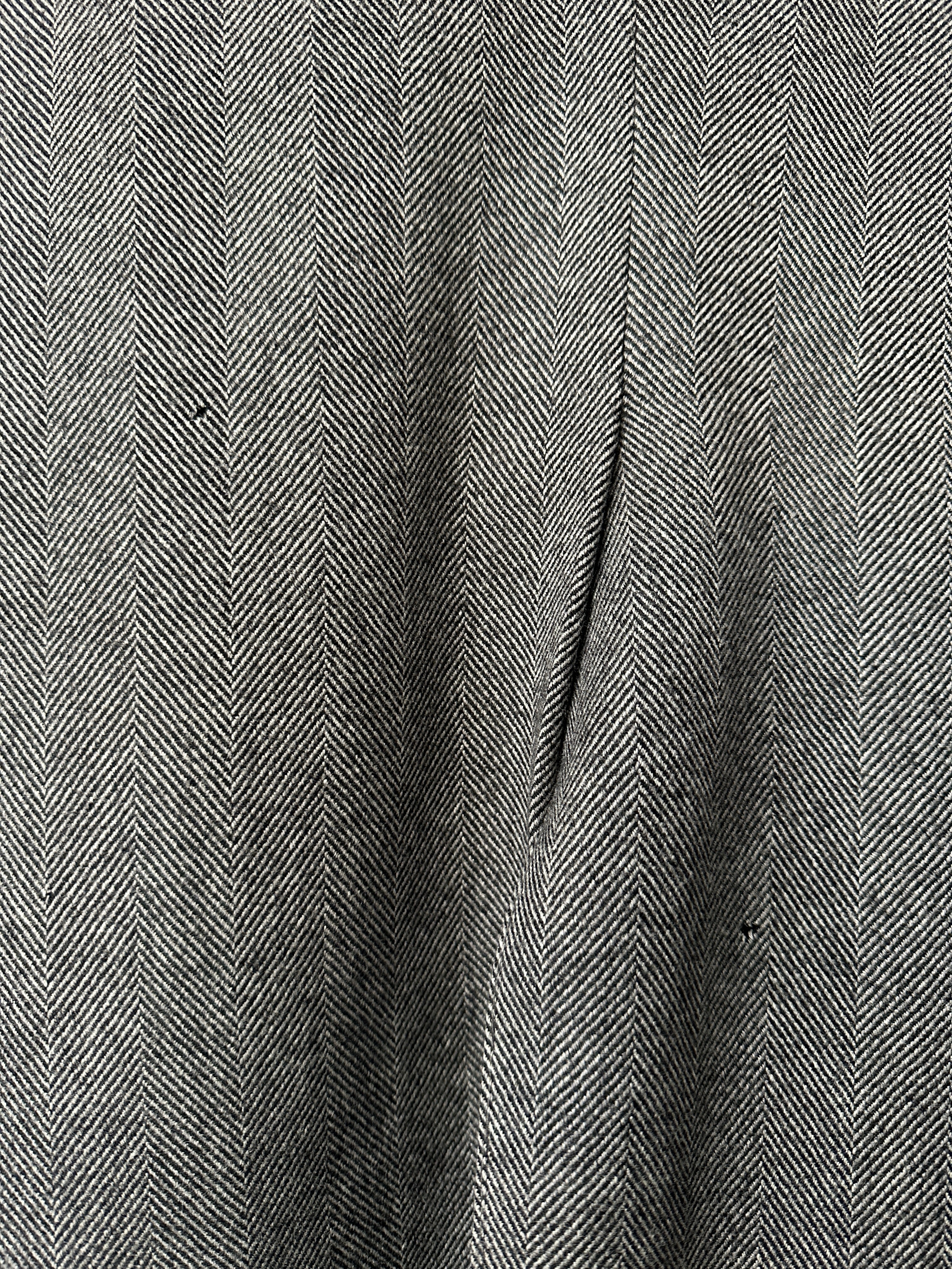 Vintage British double-breasted wool coat with herringbone pattern, in size L/XL, showcasing classic vintage style and tailored fit.