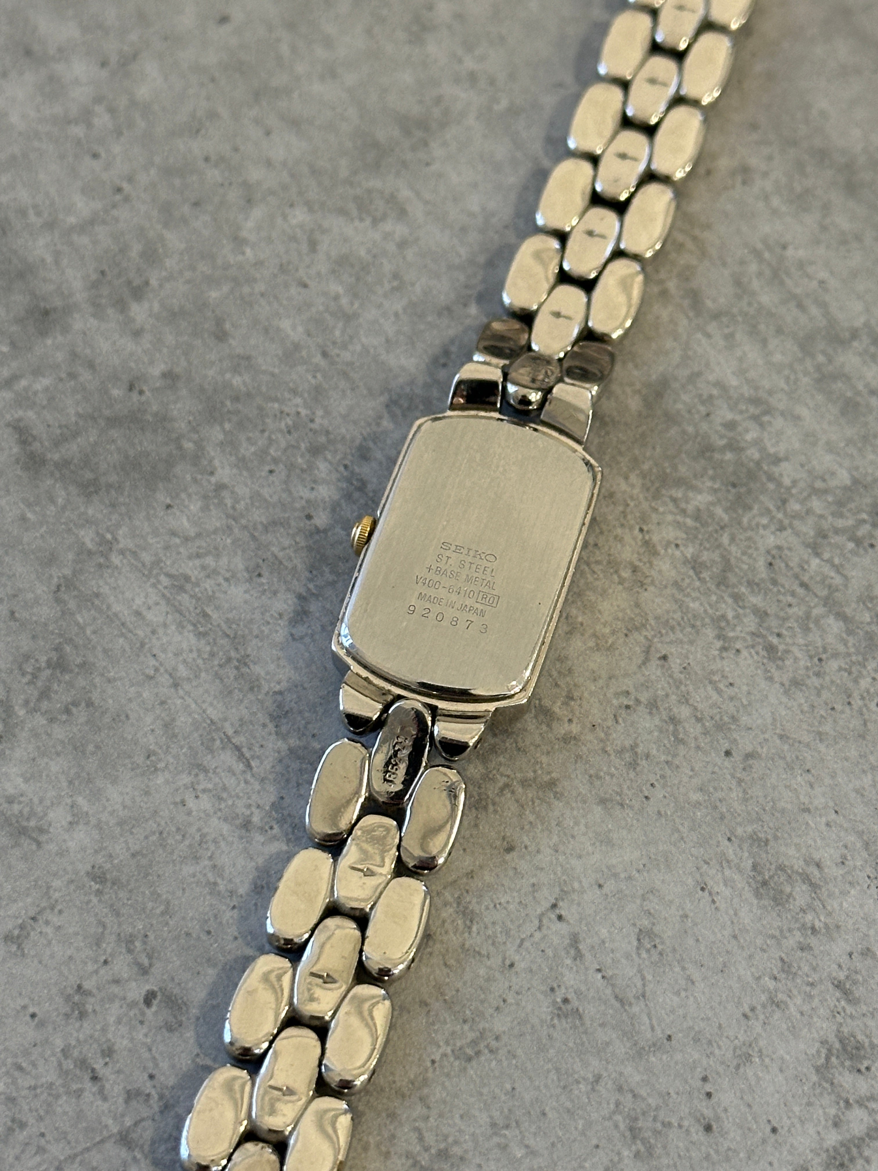 Seiko 1990s stainless steel rectangular quartz watch with a classic design and silver-tone finish.