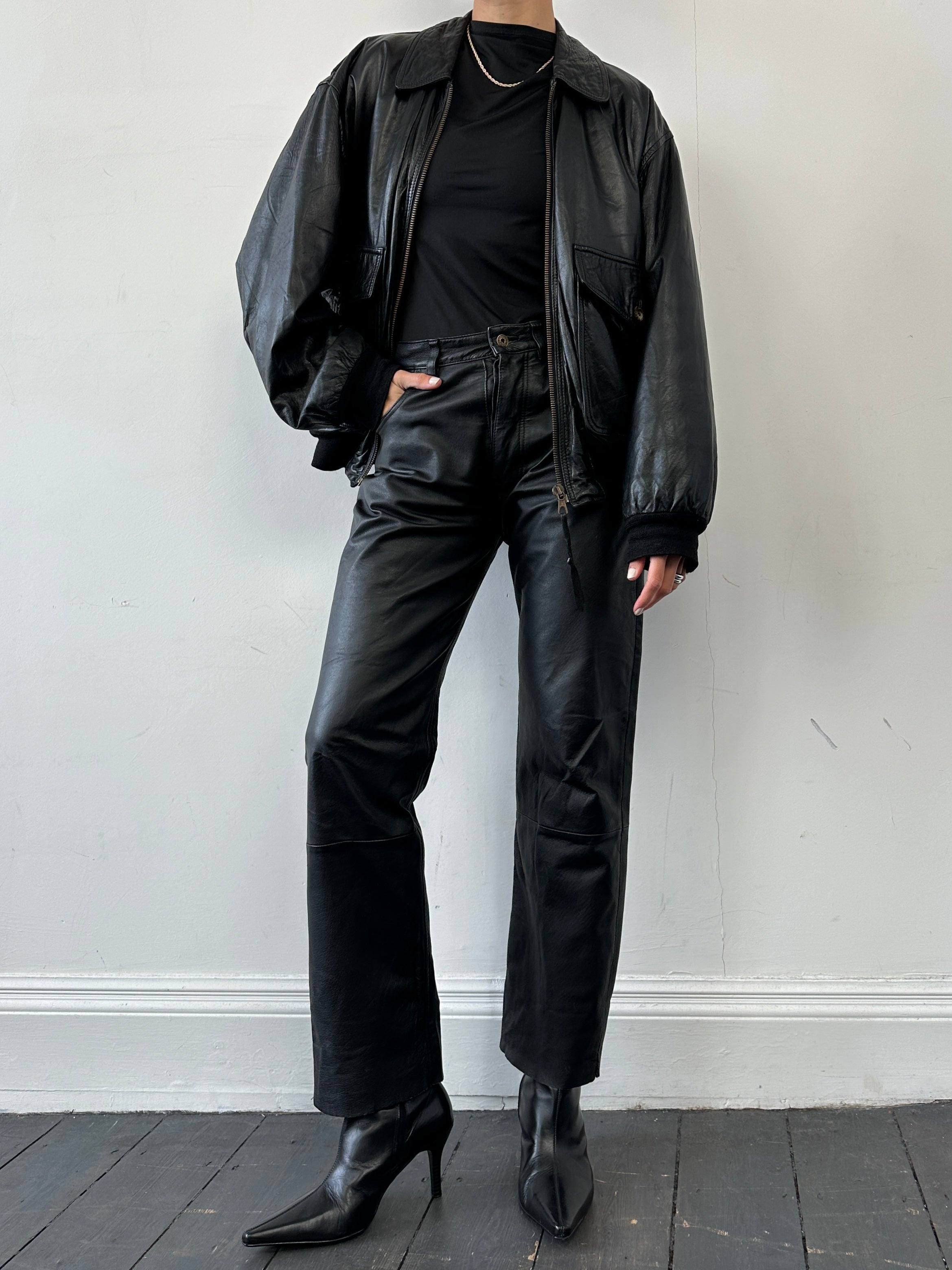 Vintage straight leg leather trousers in W30, featuring classic design and smooth leather texture, shown on a neutral background.
