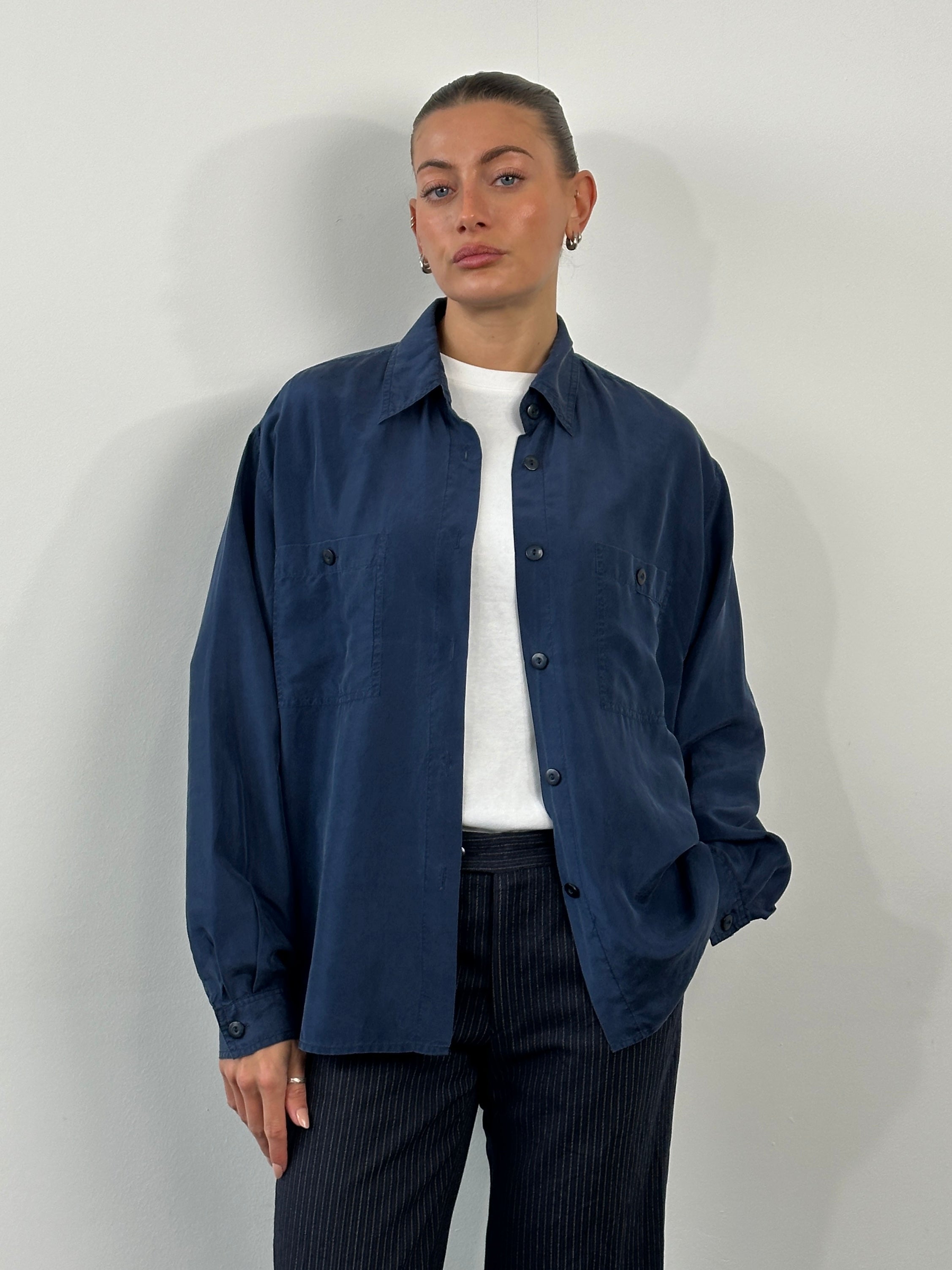 Vintage 1990s pure silk shirt in size large, featuring smooth fabric and classic design, styled for a timeless, elegant look.