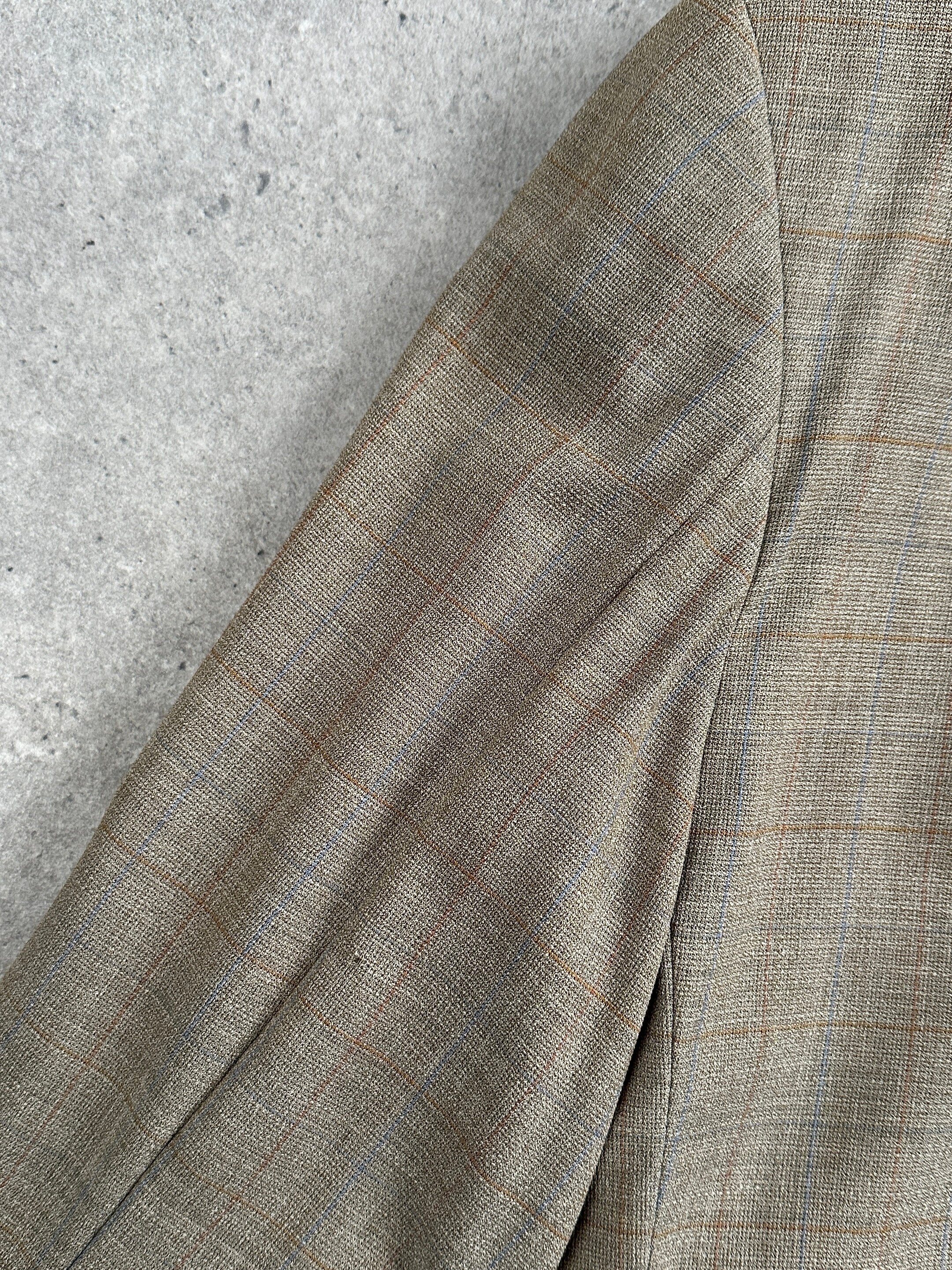 Loro Piana Roy Robson check blazer in 44R/XL with classic wool pattern, tailored fit, and detailed lapel.