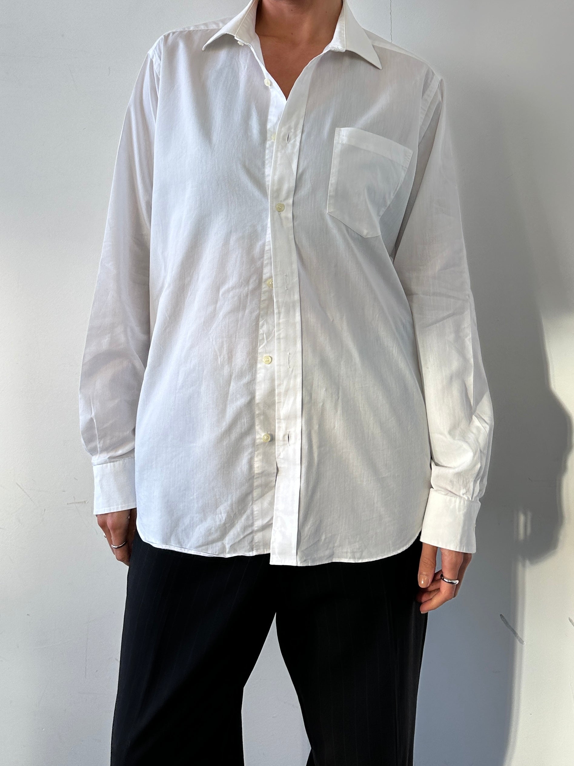 Christian Dior cotton logo shirt in size M/L, featuring the iconic Dior branding and classic white design.