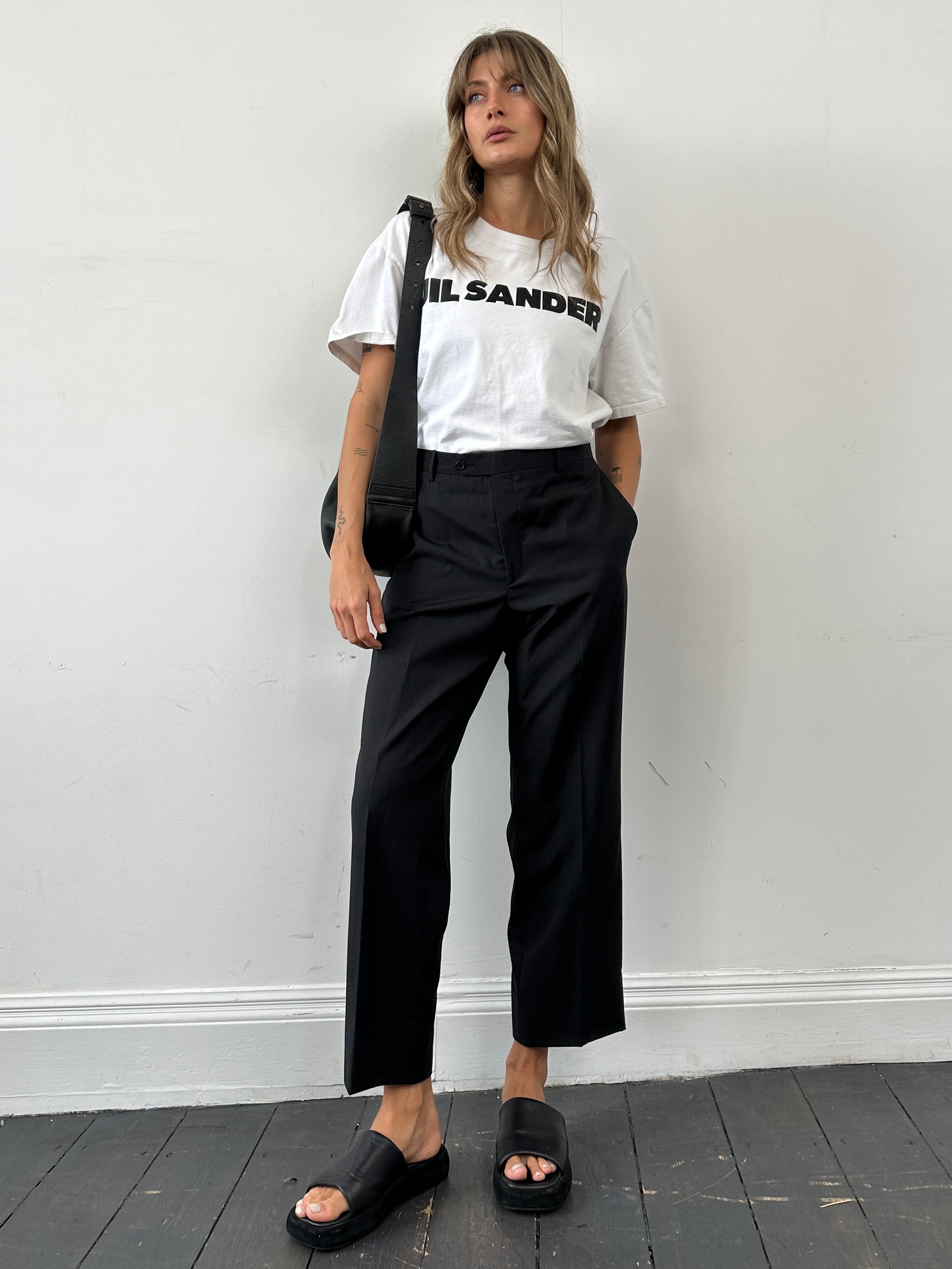 Vintage wool straight-leg tailored trousers in size W34, featuring a classic fit and neutral color, suitable for formal or casual wear.