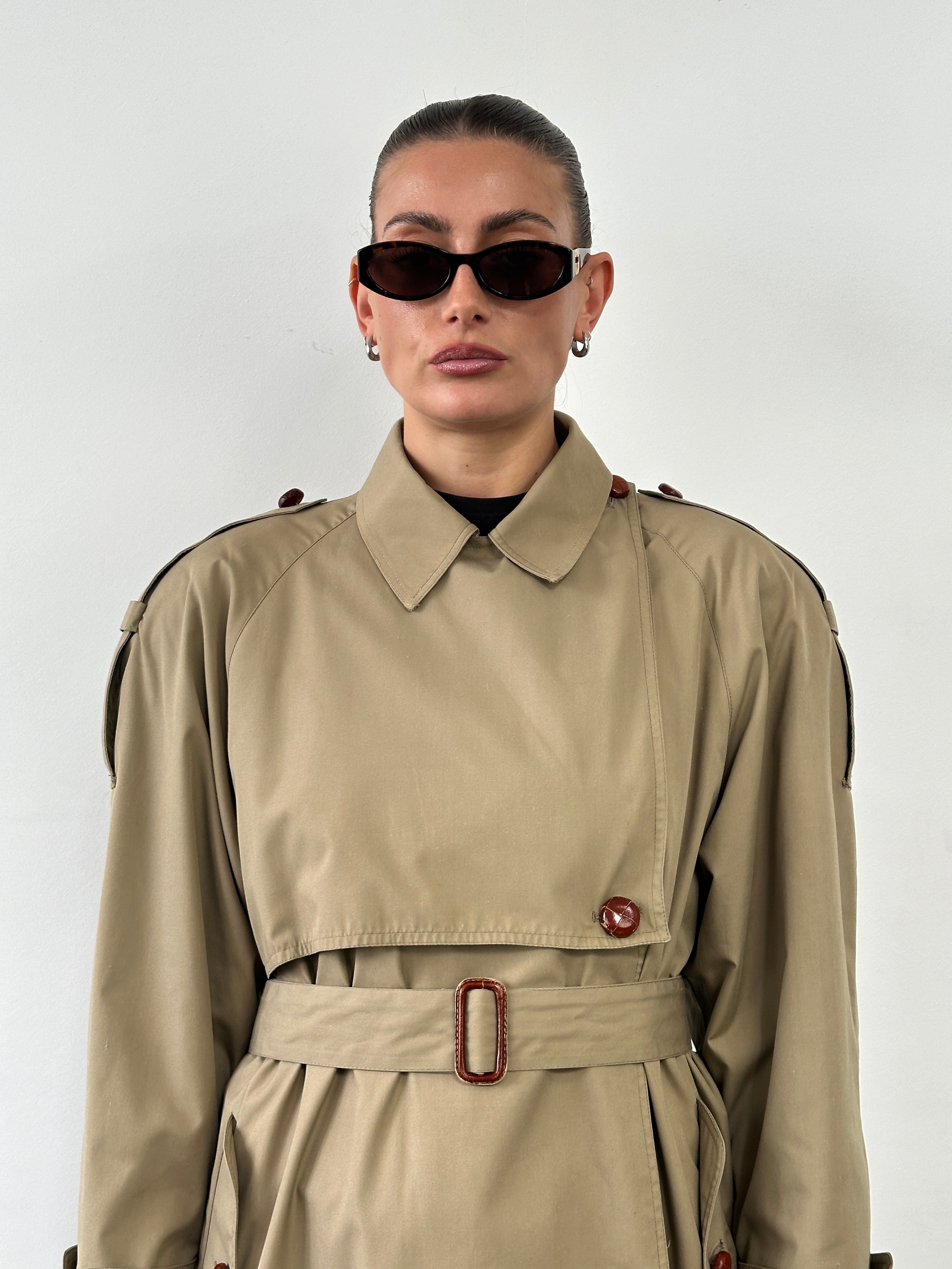 Vintage 1980s Nova Check belted trench coat in size M, featuring classic design and check pattern, displayed on a hanger.