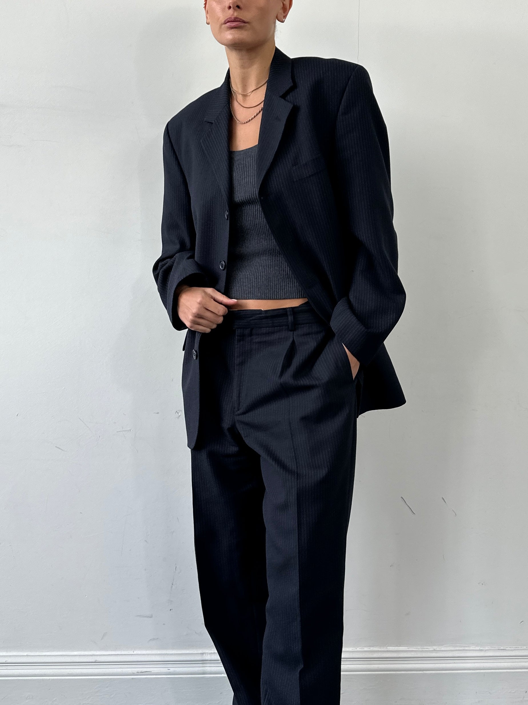 Vintage pinstripe wool single-breasted suit jumpsuit in size 40R/W34, featuring classic tailored design and pinstripe pattern.