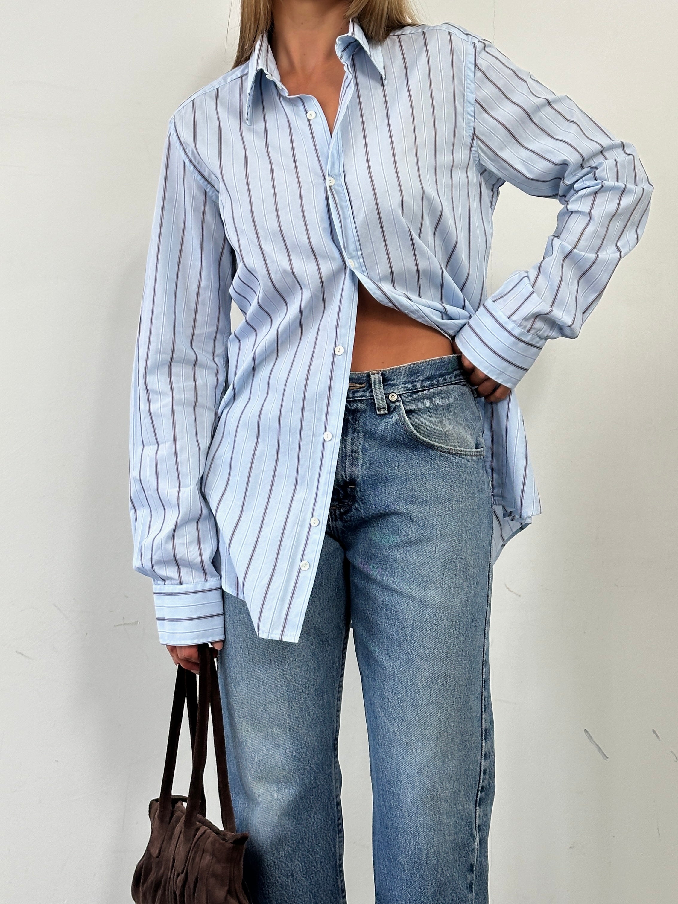 Wrangler mid wash straight leg high waisted denim jeans, front view showing classic five-pocket design and relaxed fit.