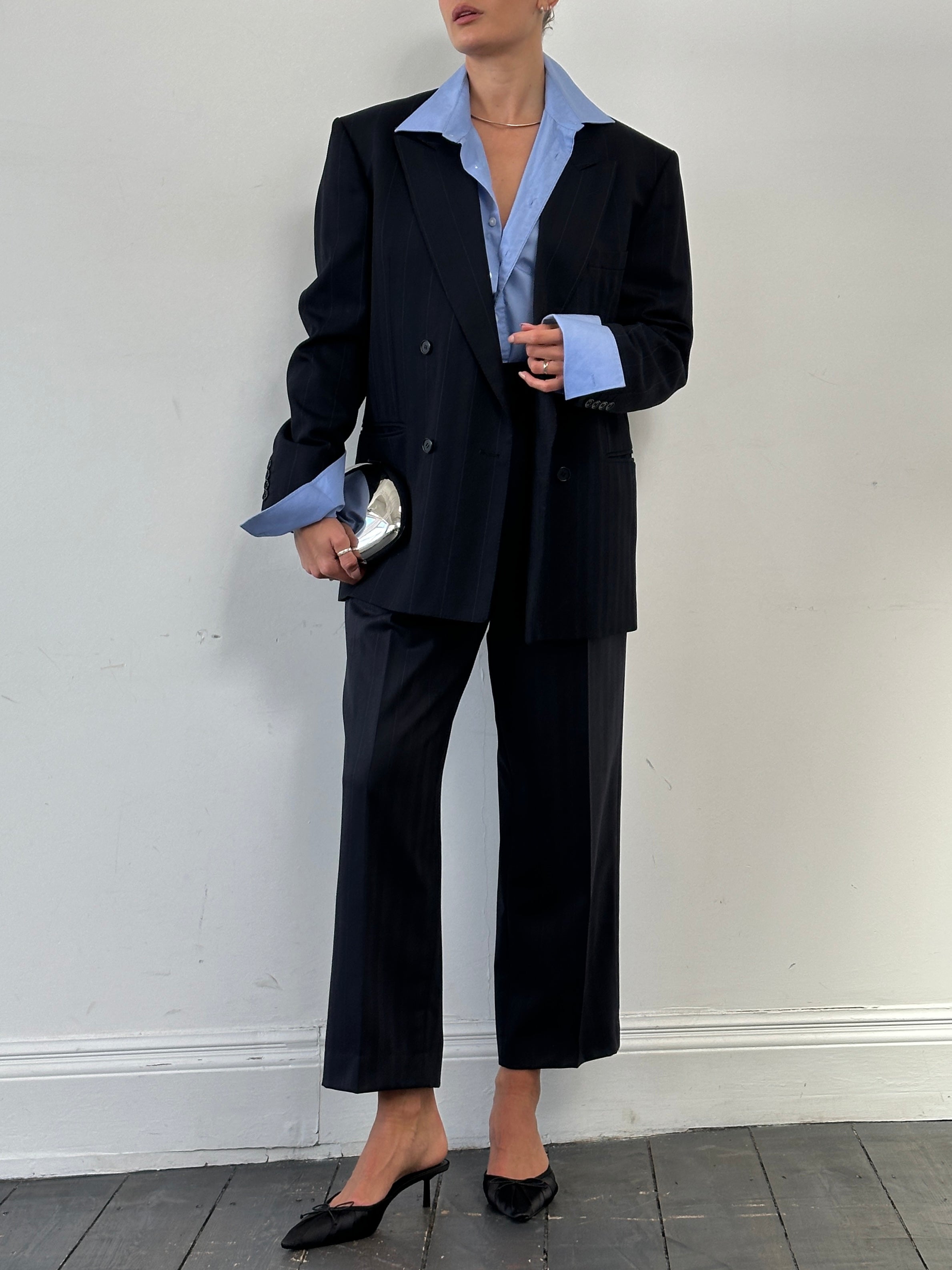 Christian Dior wool double-breasted stripe jumpsuit in size 42R/W32, tailored fit with classic design and elegant stripe pattern.