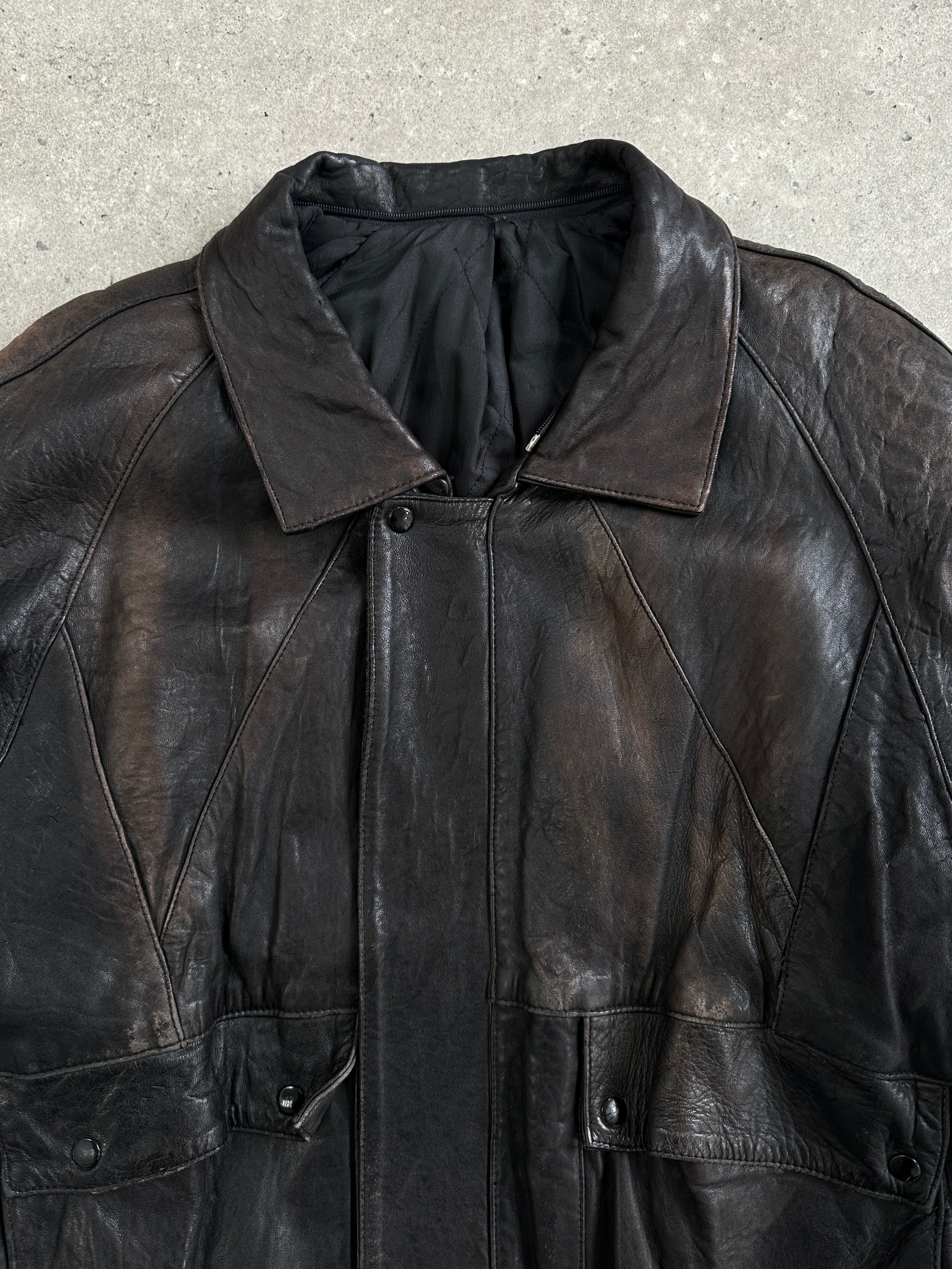 Vintage 1980s aged leather bomber jacket in XL, featuring classic design and distressed leather for a retro look.