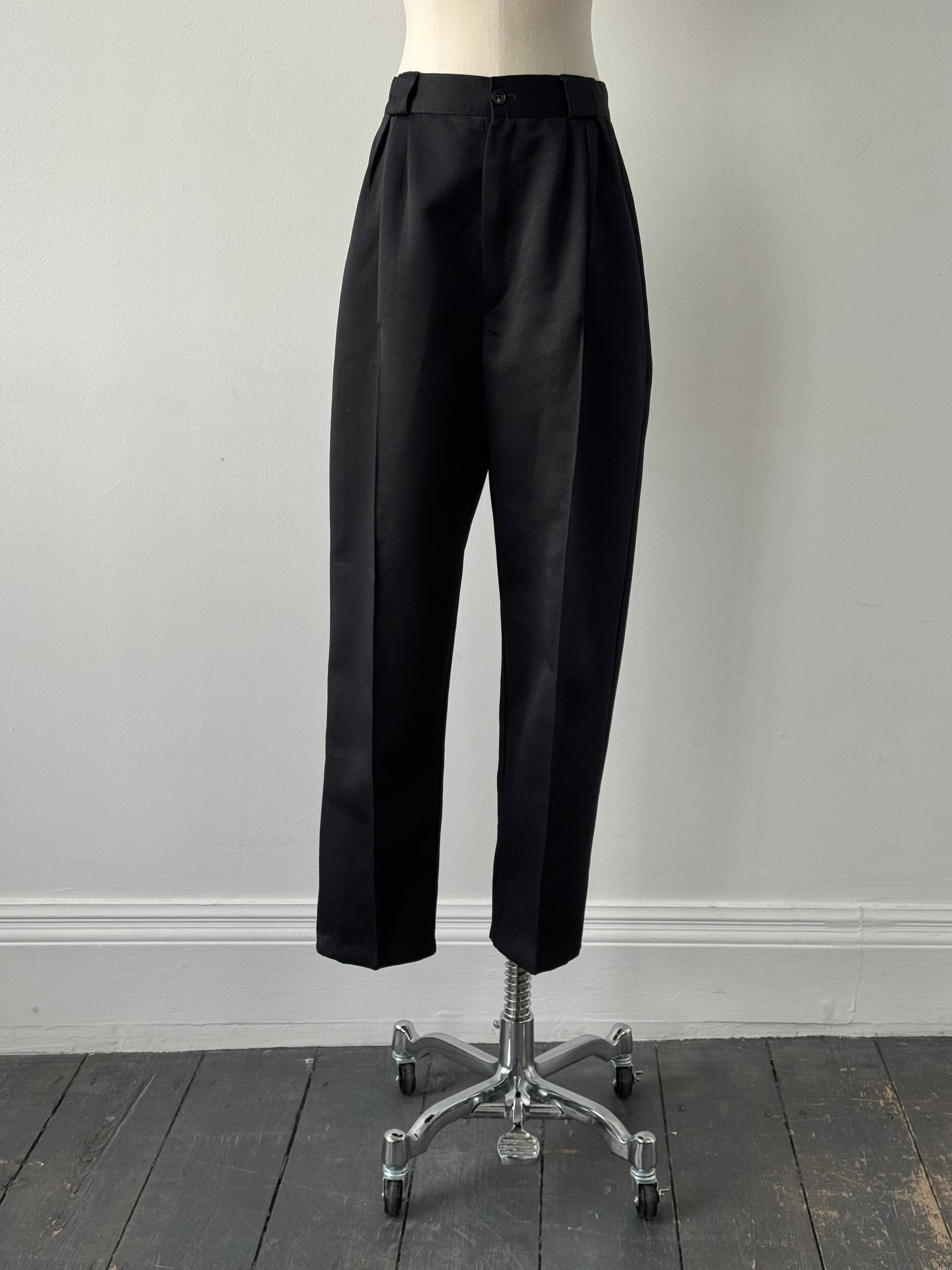 Vintage 1980s satin tapered leg high-waisted trousers in black, featuring a classic vintage style with a sleek fit.