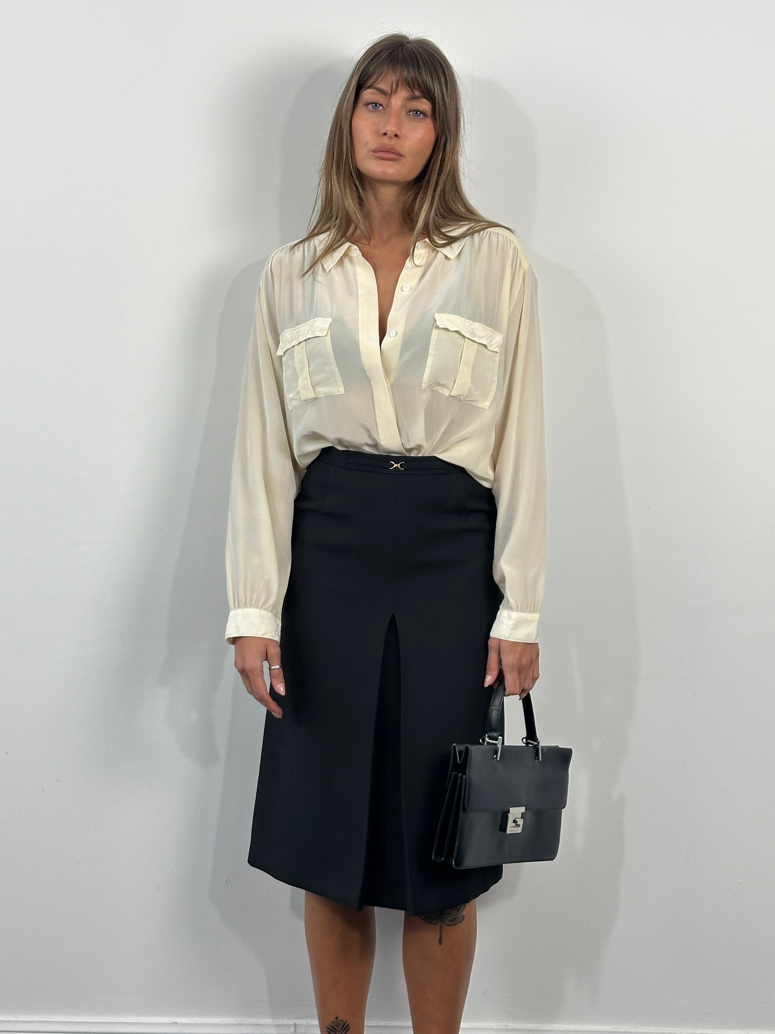 Vintage 1990s A-line skirt in size W26, featuring classic retro style with a flowing silhouette and vintage fabric details.