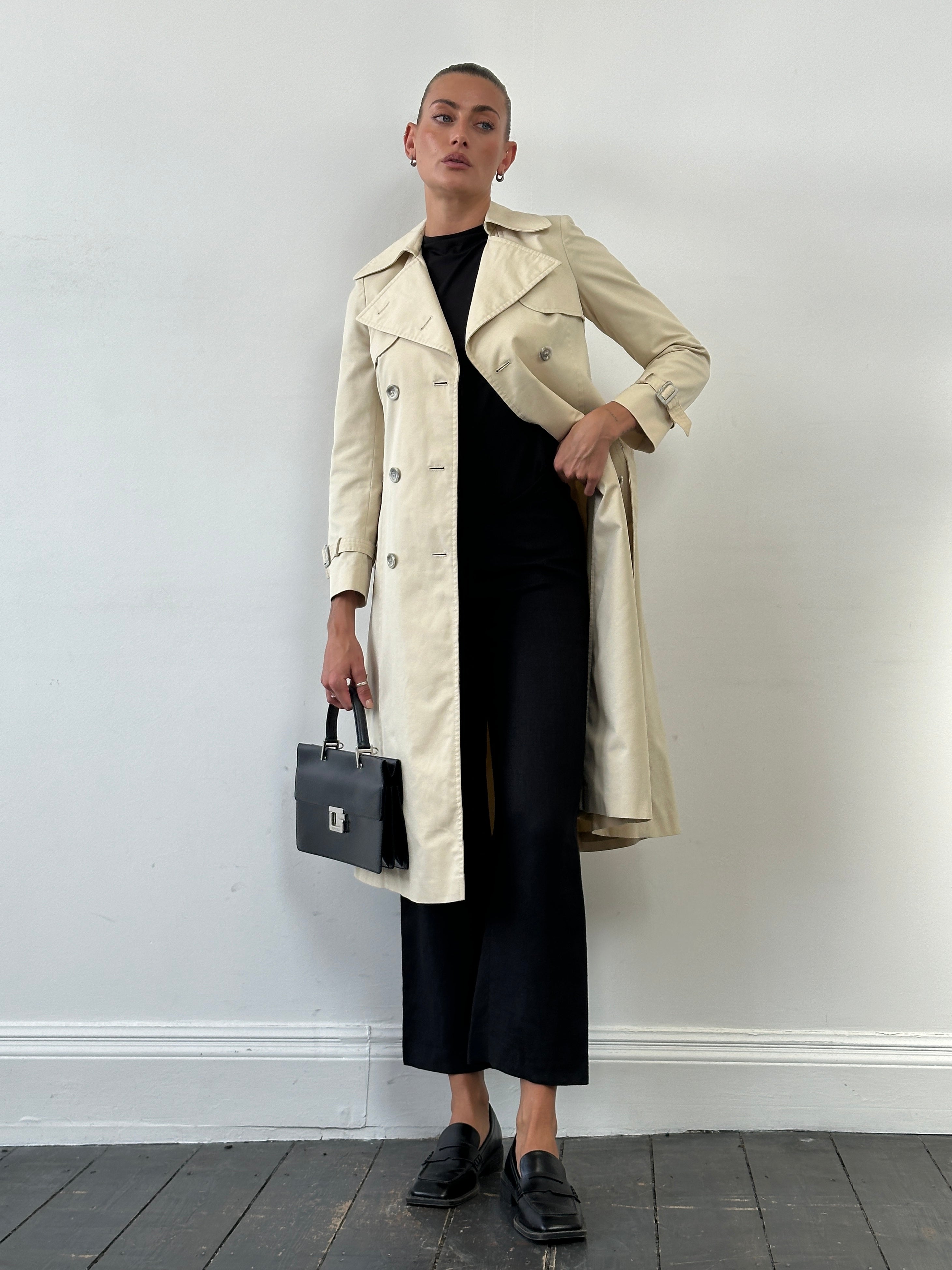 Vintage 1980s cotton double-breasted trench coat with belt, XS size, featuring classic style and timeless design.