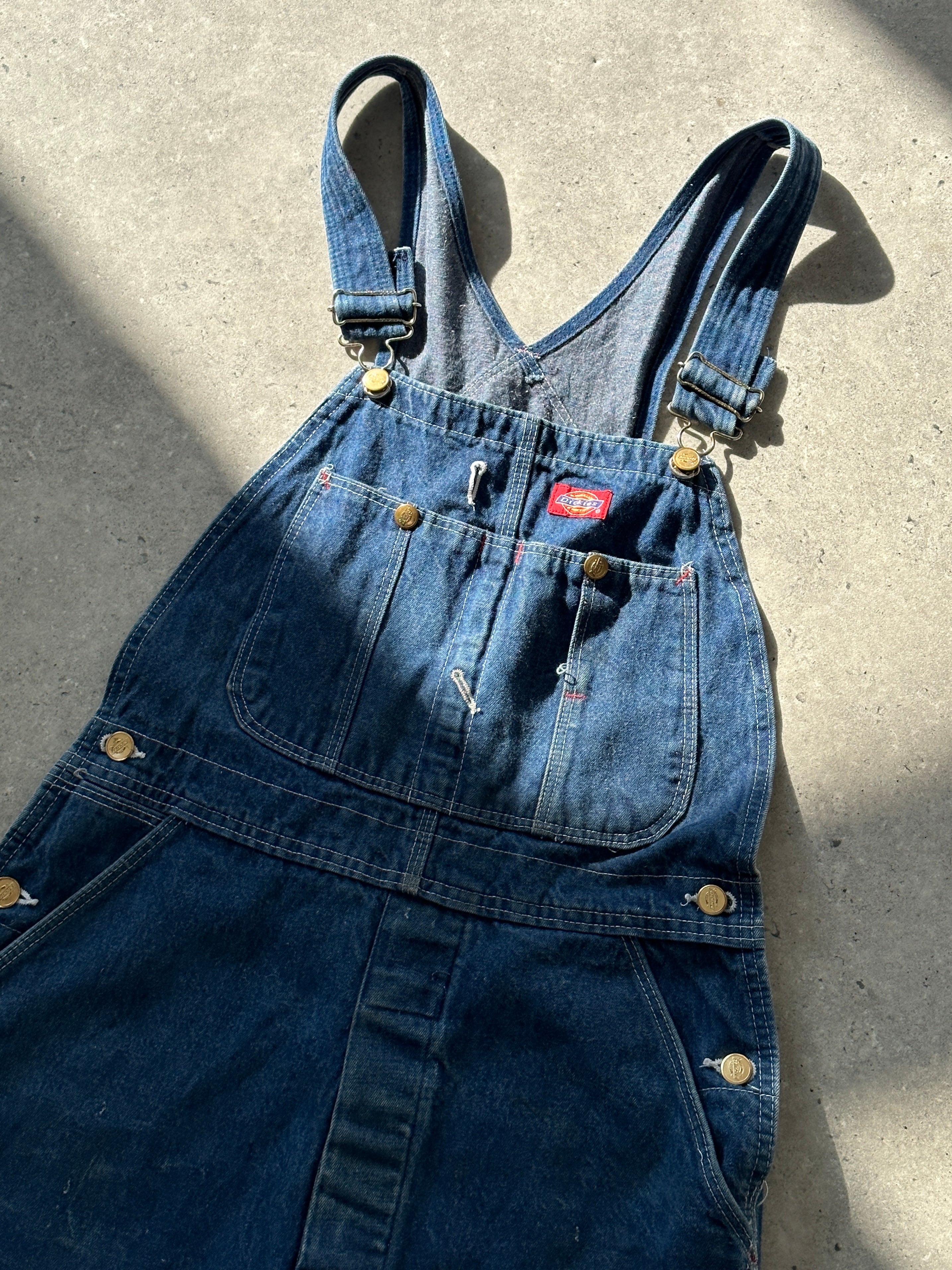 Dickies pure cotton denim dungarees in XS/S size with adjustable shoulder straps and front pockets, displayed on a plain background.