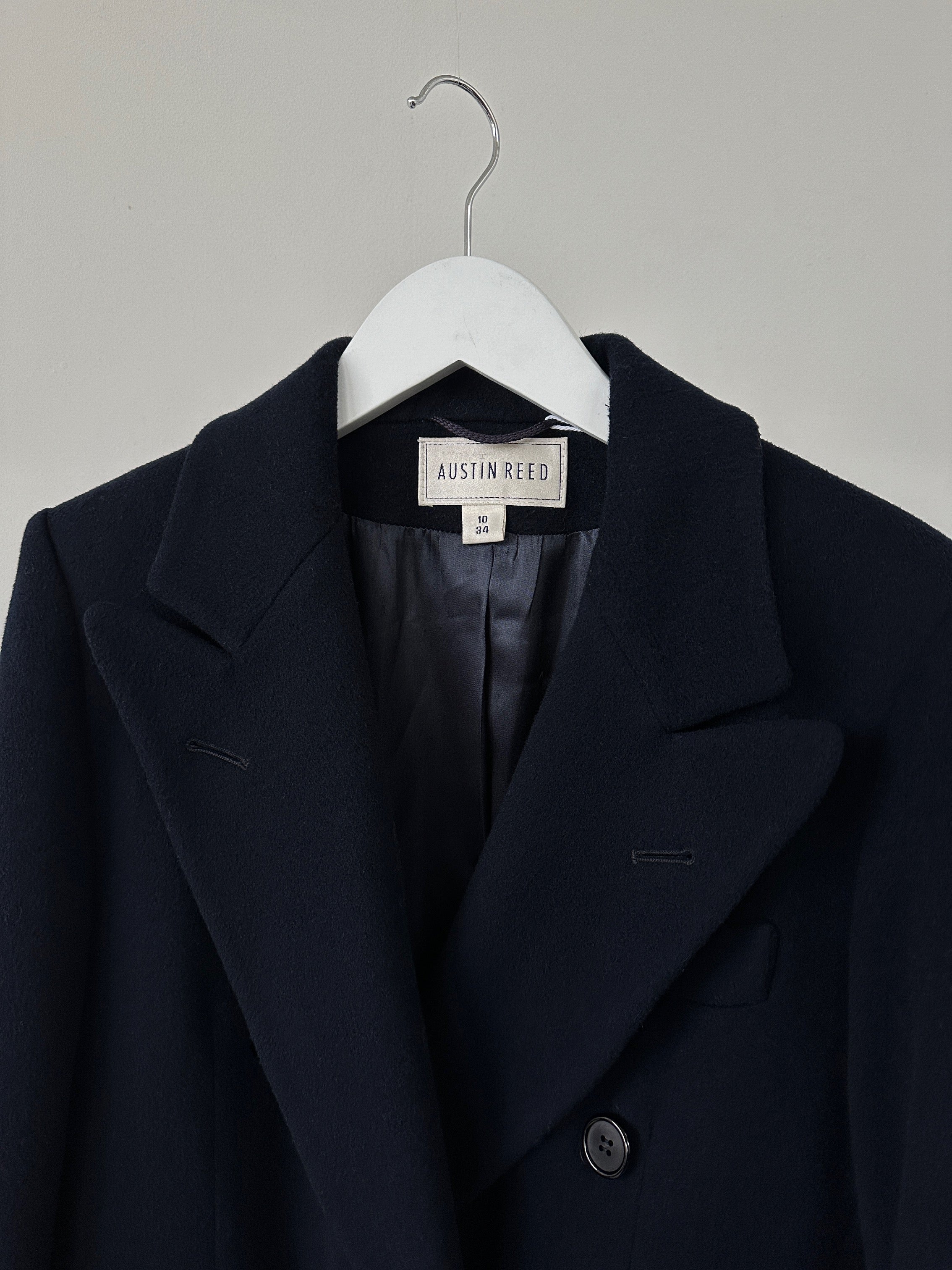 Vintage wool cashmere double-breasted coat in size S, showcasing classic style and textured fabric with lapel collar and button details.
