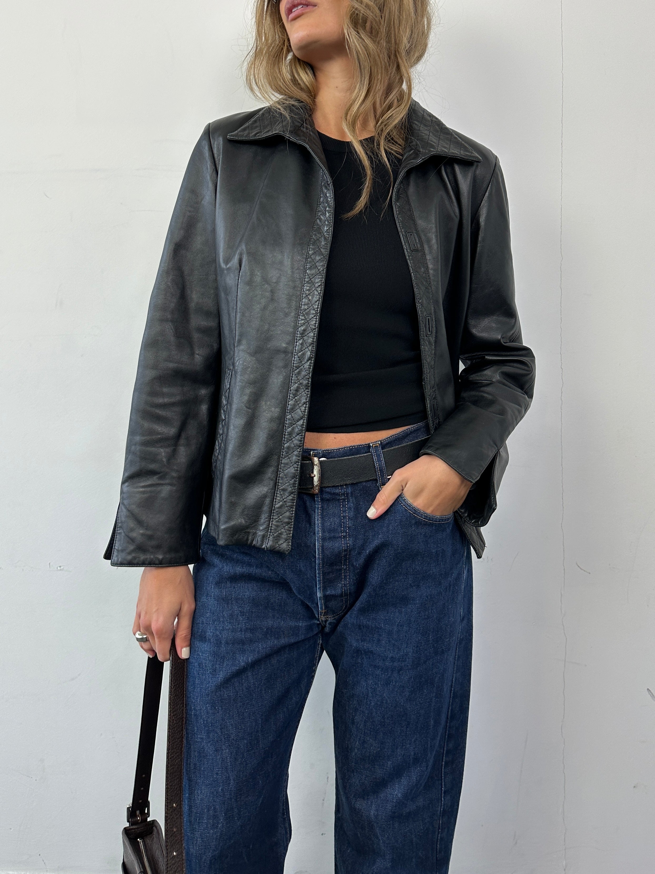 Vintage Italian leather jacket in size small, featuring classic vintage style and high-quality distressed leather.