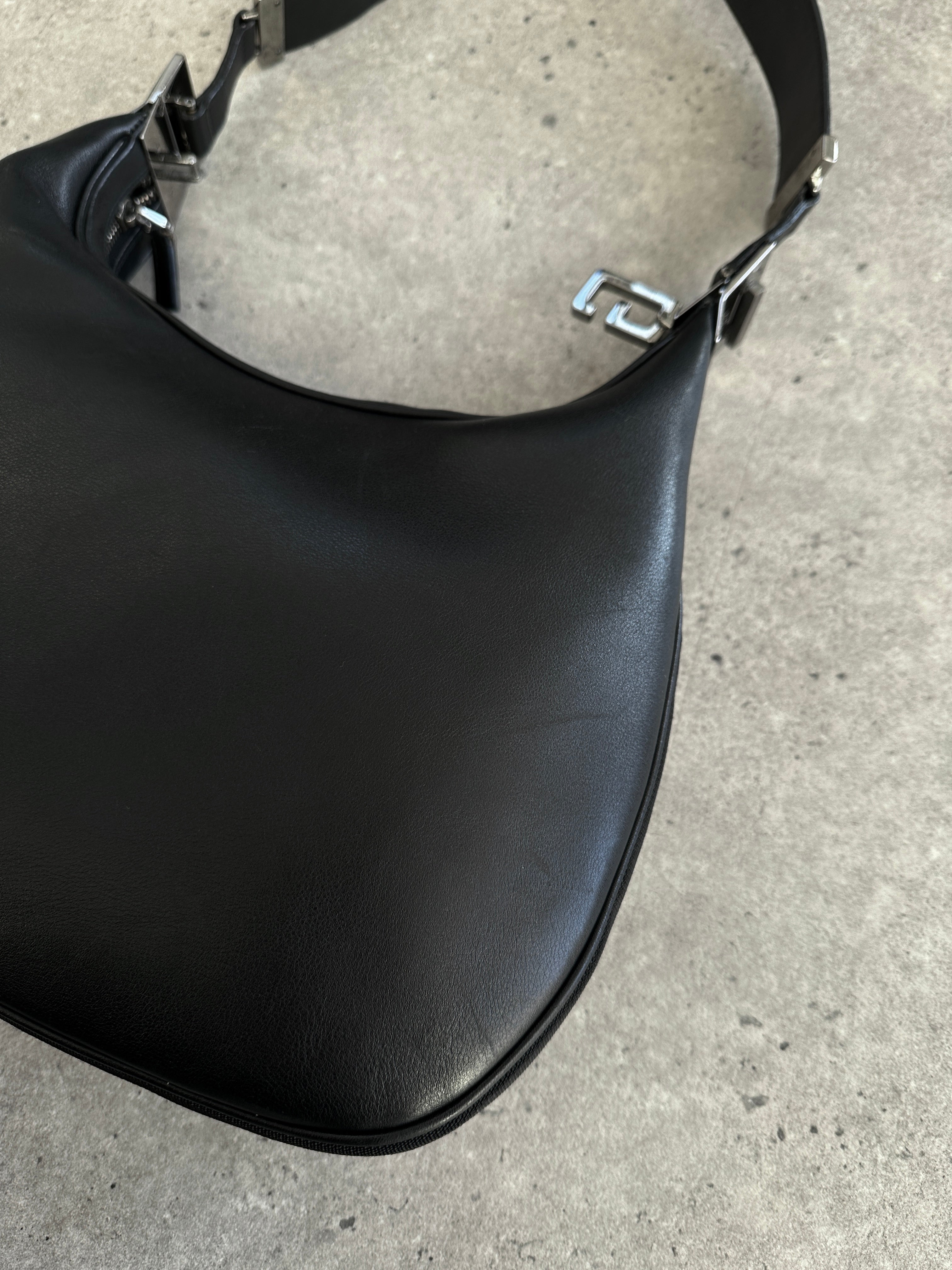 Gucci 1990s Tom Ford GG 3-in-1 leather attache bag with multiple compartments and classic Gucci branding.