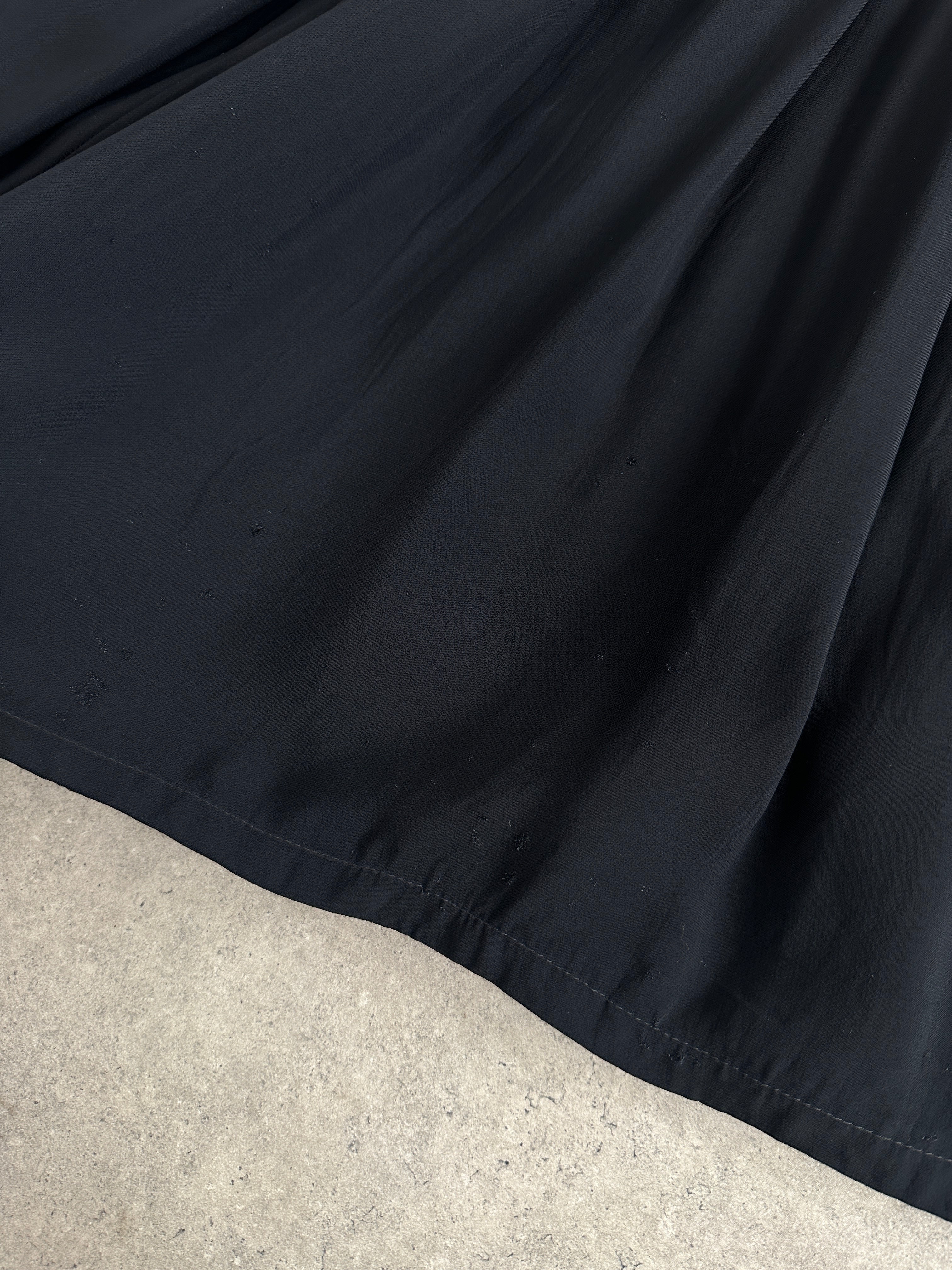 Iceberg pleated belted midi skirt in W28, showcasing its flowy fabric, pleats, and stylish belt detail.