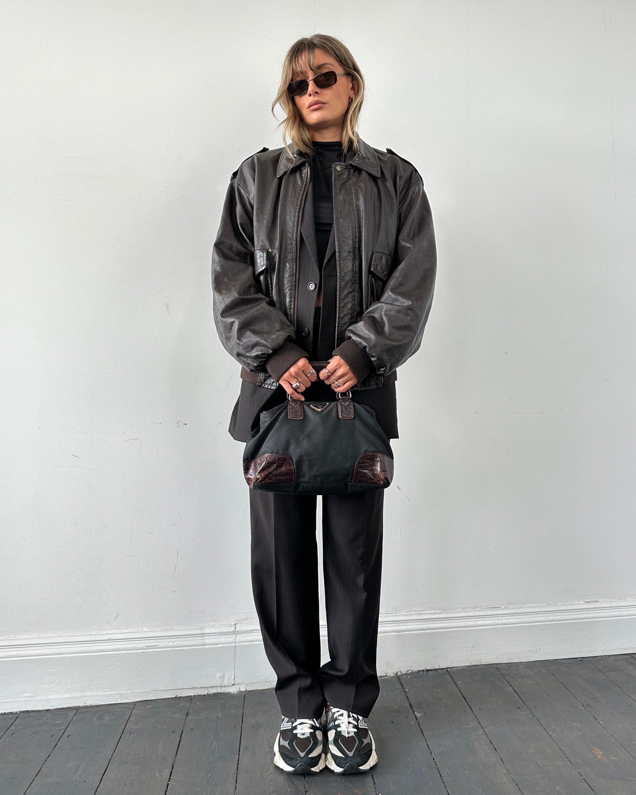 Prada nylon croc handbag featuring a sleek design with textured crocodile pattern and sturdy straps.