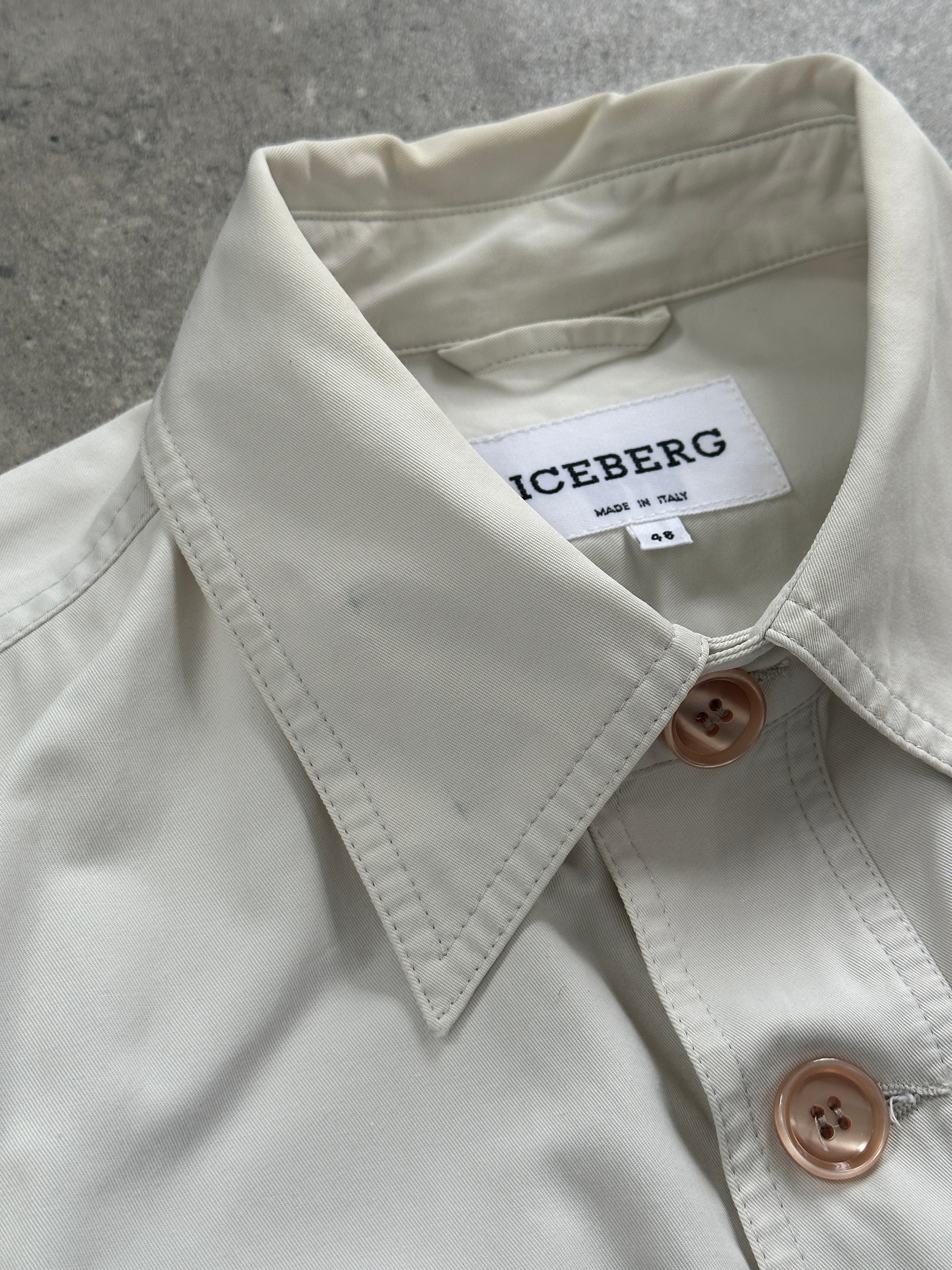 Iceberg button-up bomber jacket in black, featuring a fitted design and ribbed cuffs, displayed on a hanger.