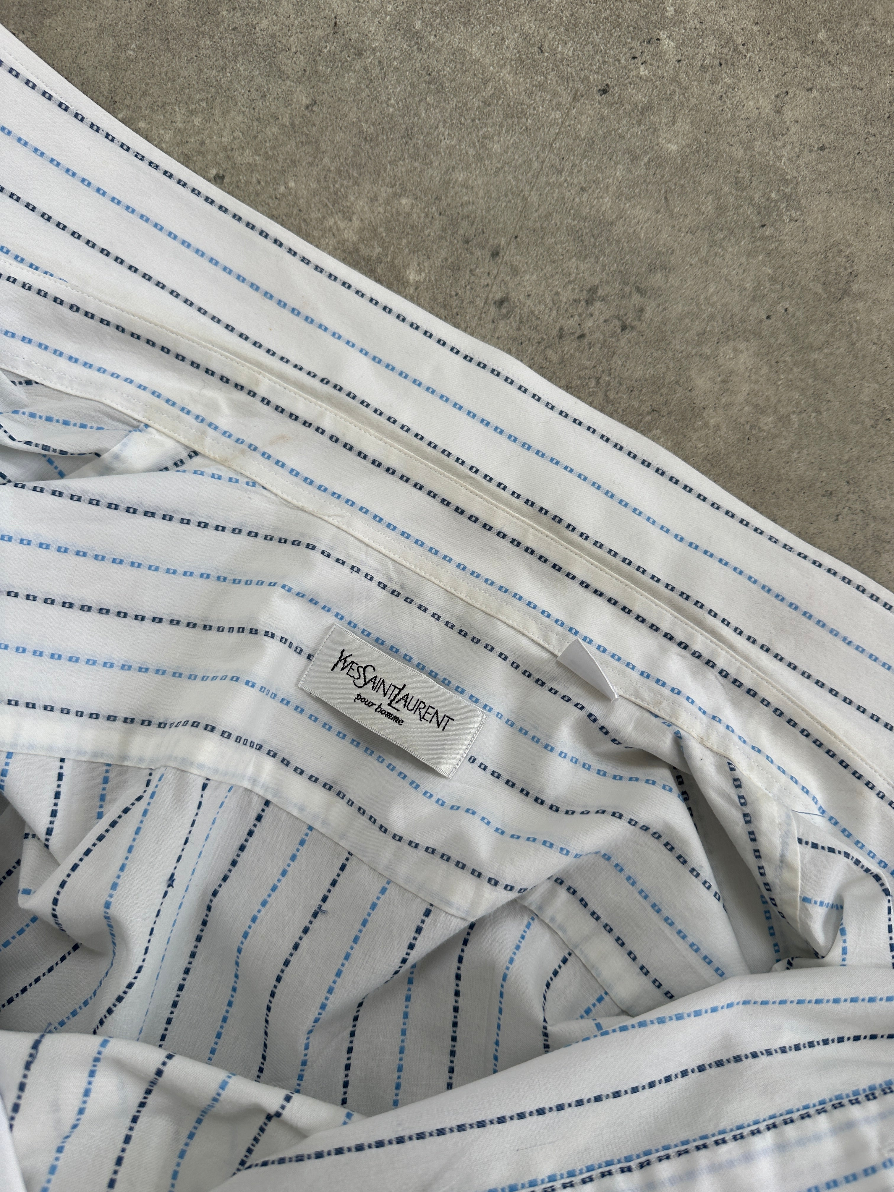 Yves Saint Laurent Pour Homme cotton check short sleeve logo shirt in size L, featuring a classic plaid pattern and YSL branding.