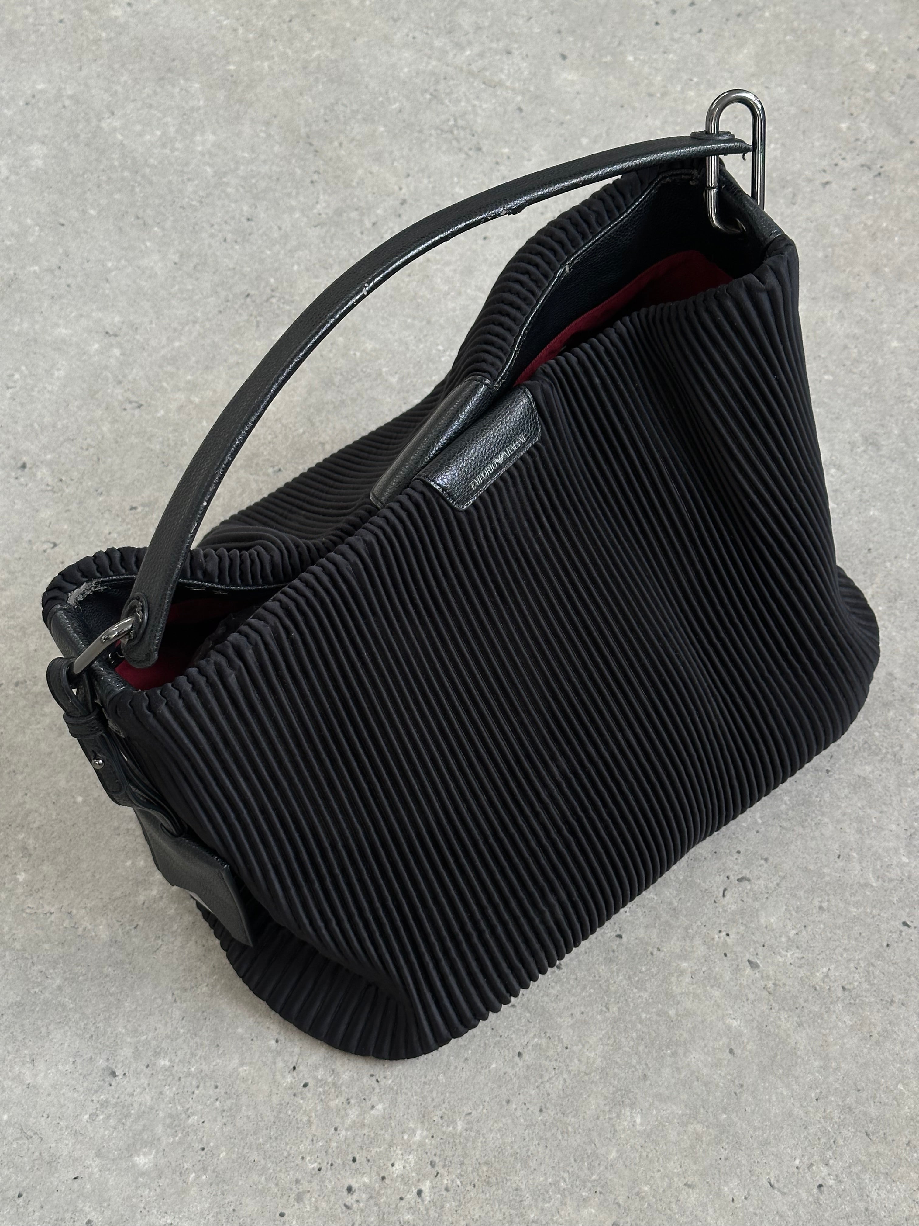Emporio Armani pleated shoulder bag with structured design and elegant details, featuring a sleek strap and classic style.