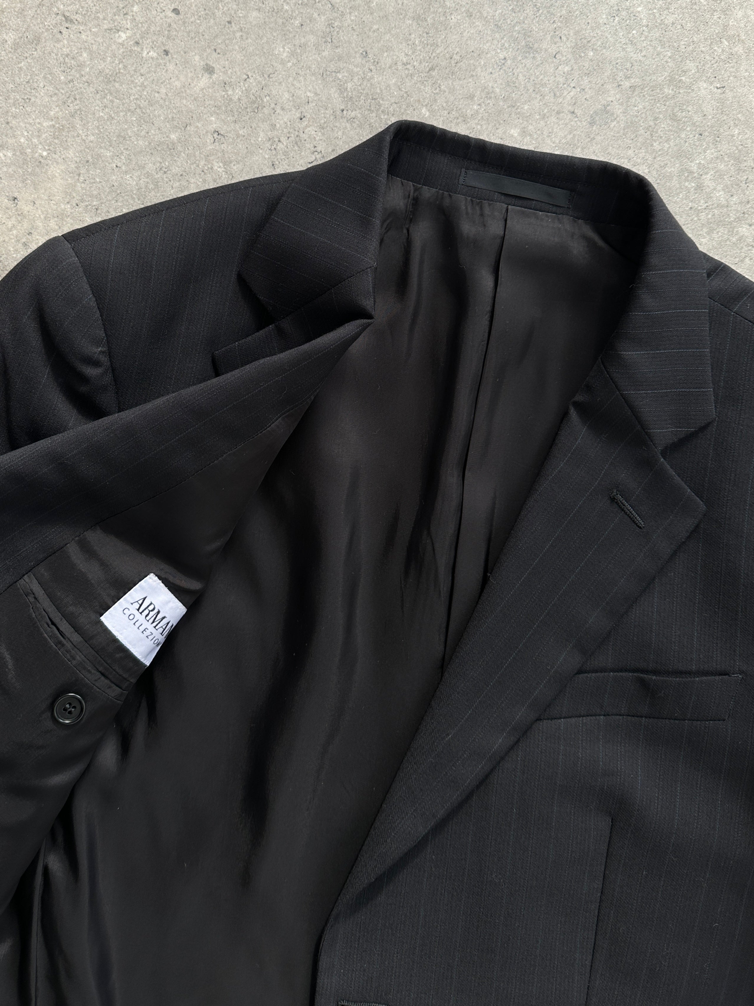 Armani Collezioni pinstripe pure wool single-breasted blazer in size 40R/M, displayed on a hanger showing classic tailored fit.