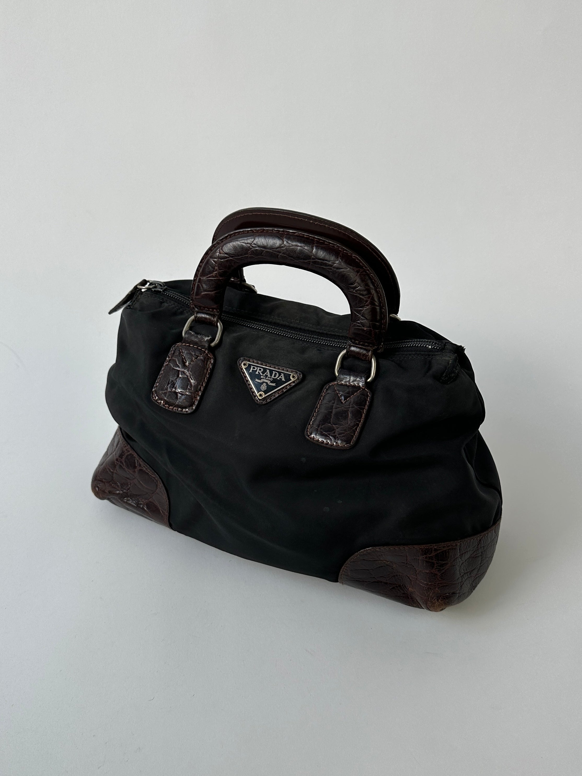 Prada nylon croc handbag with sleek design, featuring textured crocodile pattern and sturdy strap for stylish everyday use.