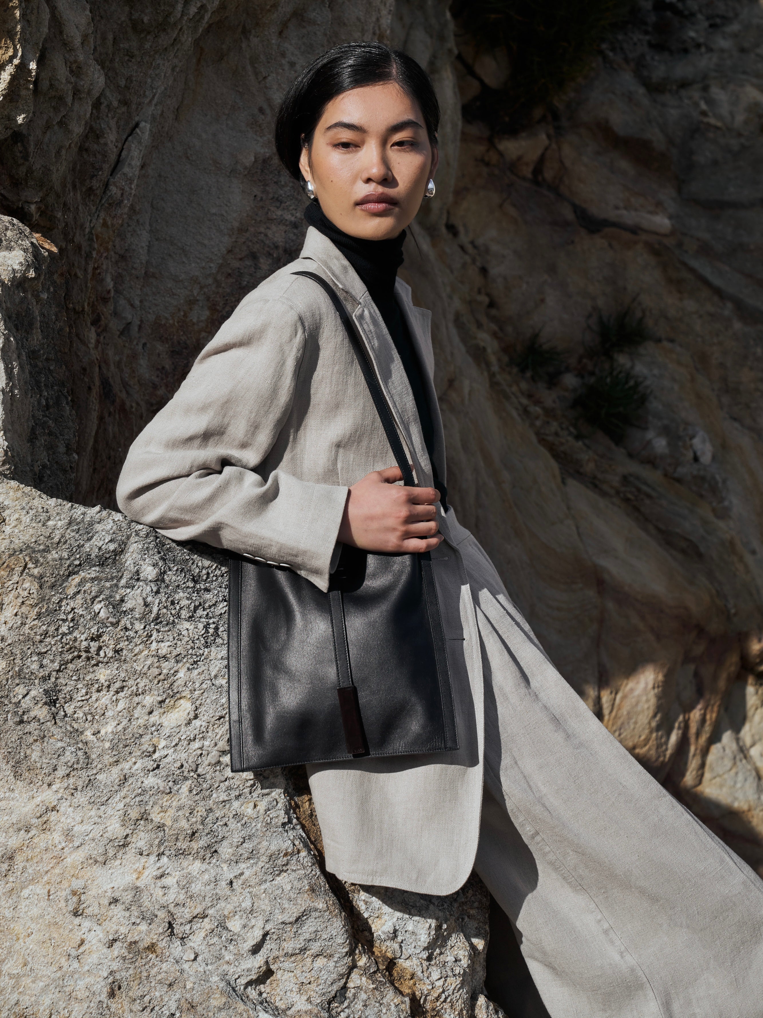 Gucci minimal rectangle leather bag with sleek design and adjustable strap, featuring a smooth leather finish and elegant style.