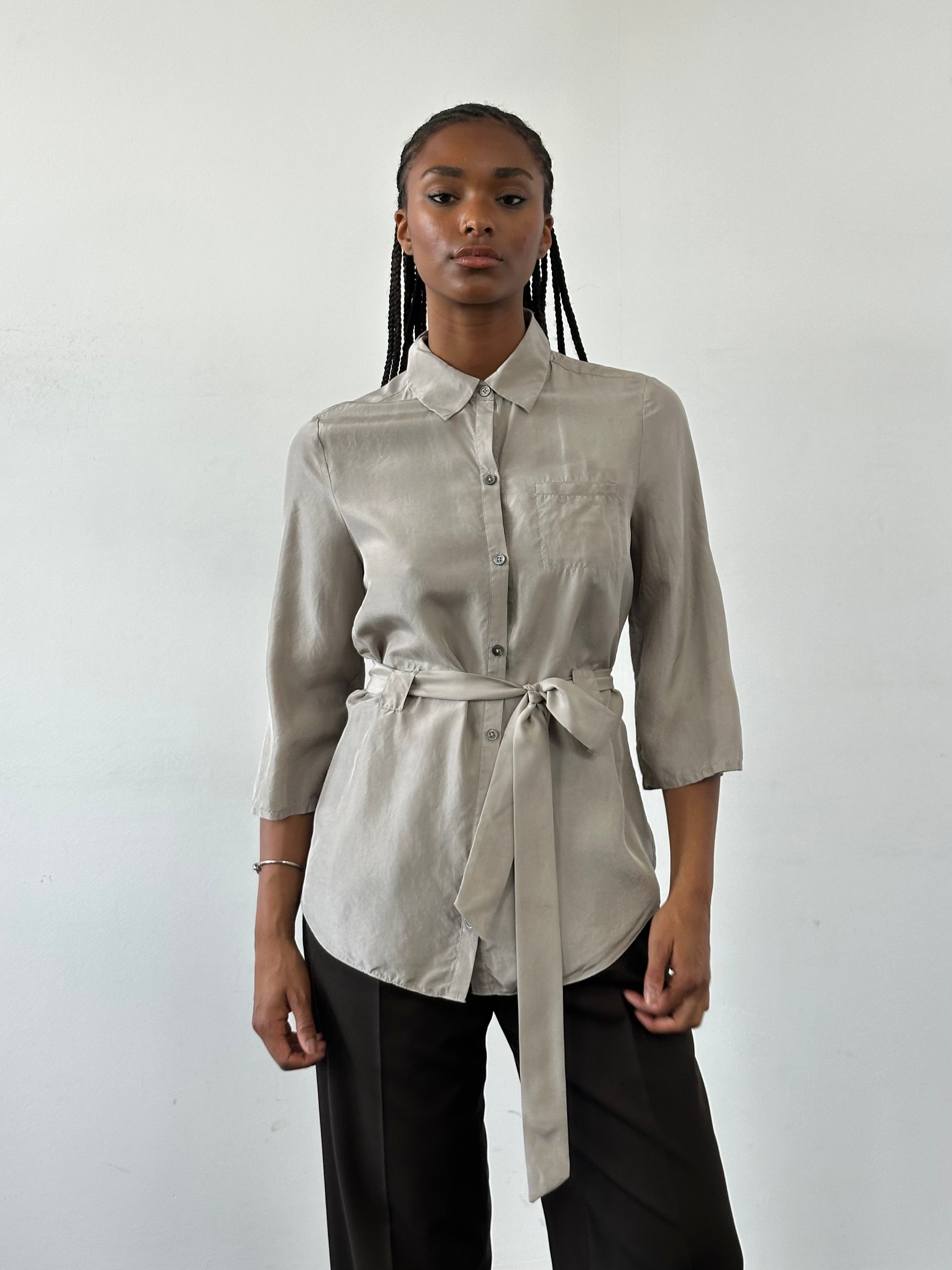 Jaeger Pure Silk Belted Shirt in size S, displayed on a hanger with a classic collar and button-front design.