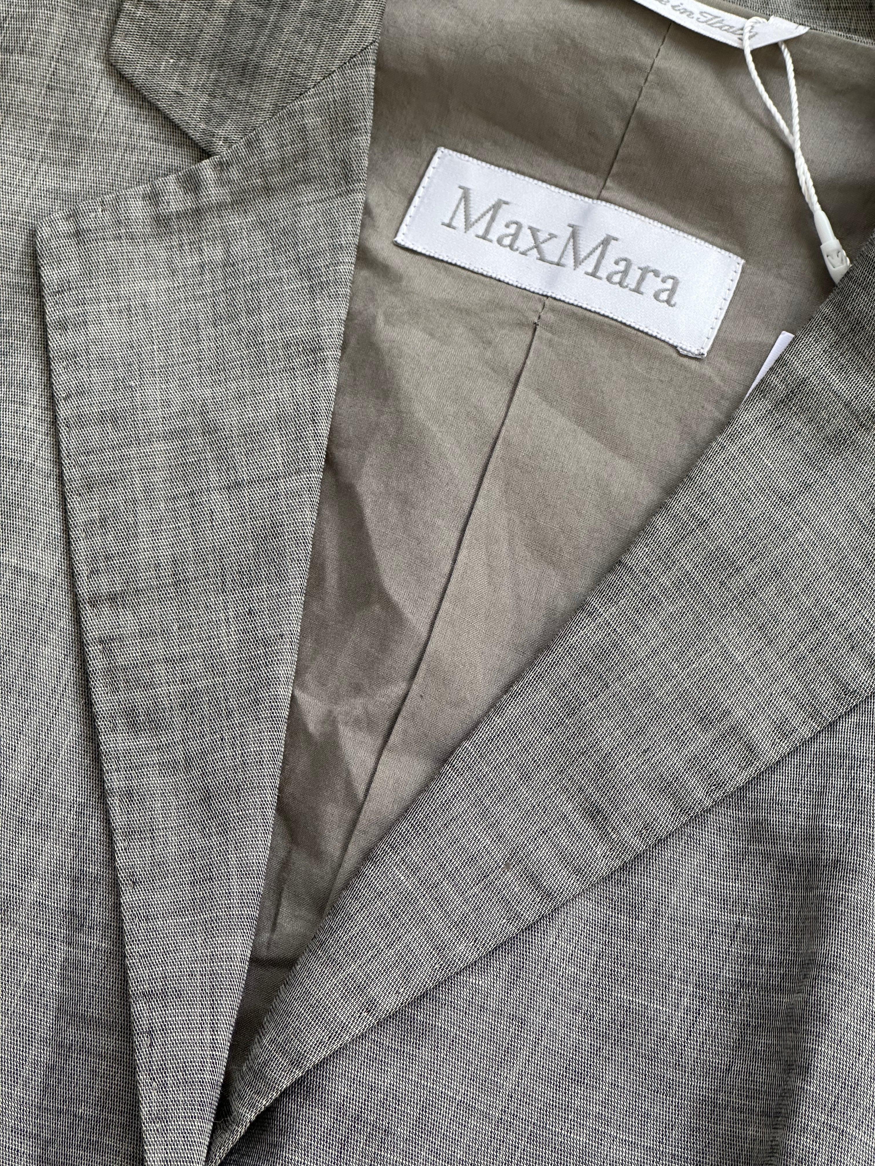 Max Mara cotton linen waistcoat in size S/M displayed on a hanger, featuring a classic tailored design with a neutral color.