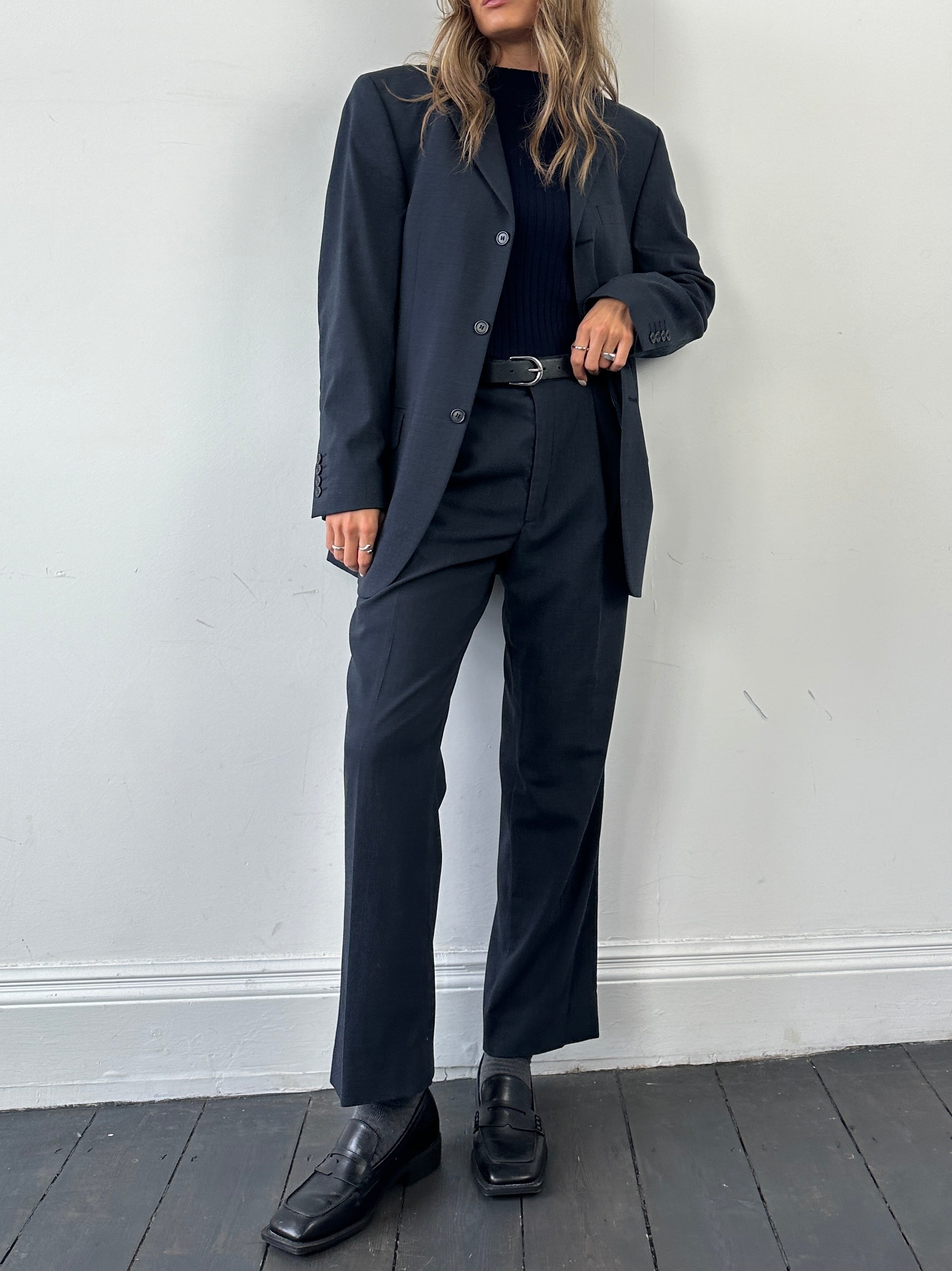 Vintage wool single-breasted jumpsuit in size 38R/W30, featuring classic tailored design and vintage fabric details.